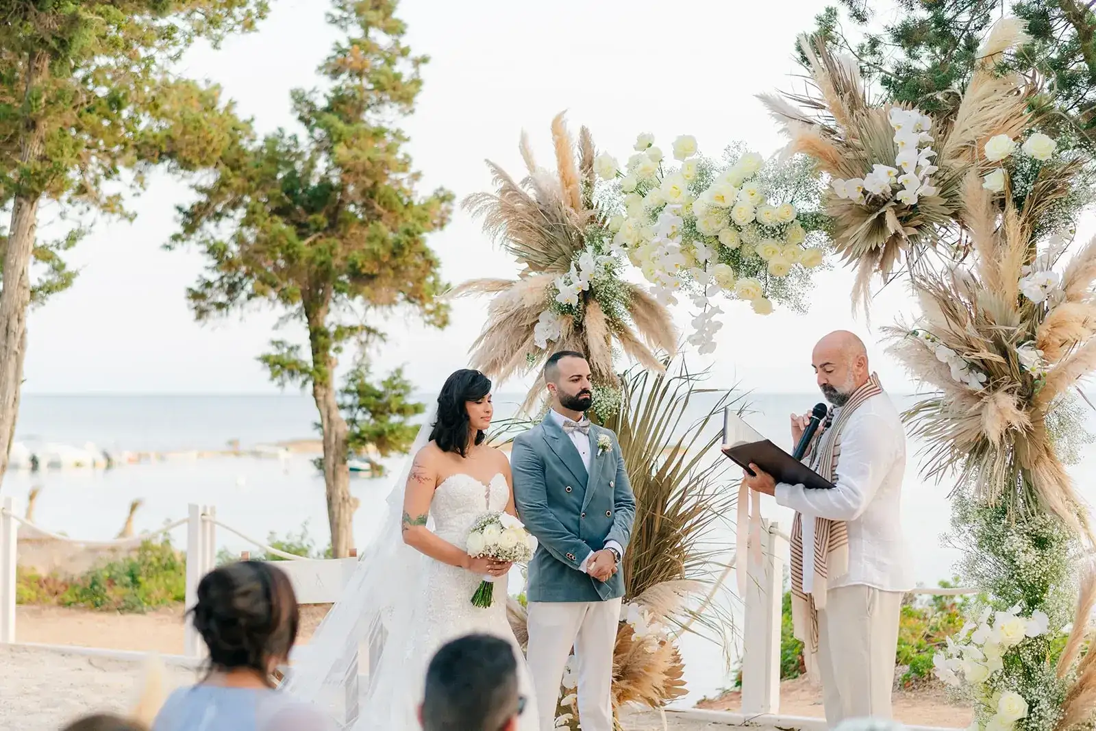 Vows under pampas and white flowers on the beach, Nikki Beach Ibiza
