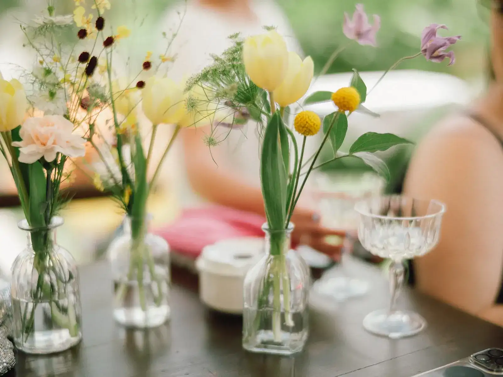 Yellow tulips and spring flowers in bud vases, Can CG