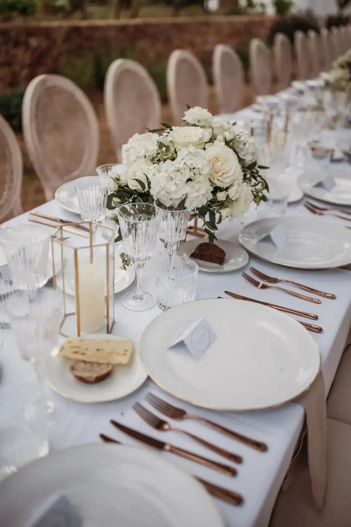 White roses, gold lanterns and white china