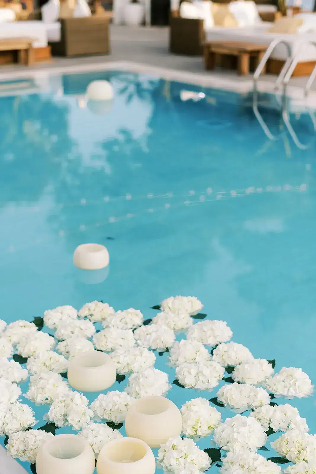 White flowers floating in the pool, Nikki Beach Ibiza
