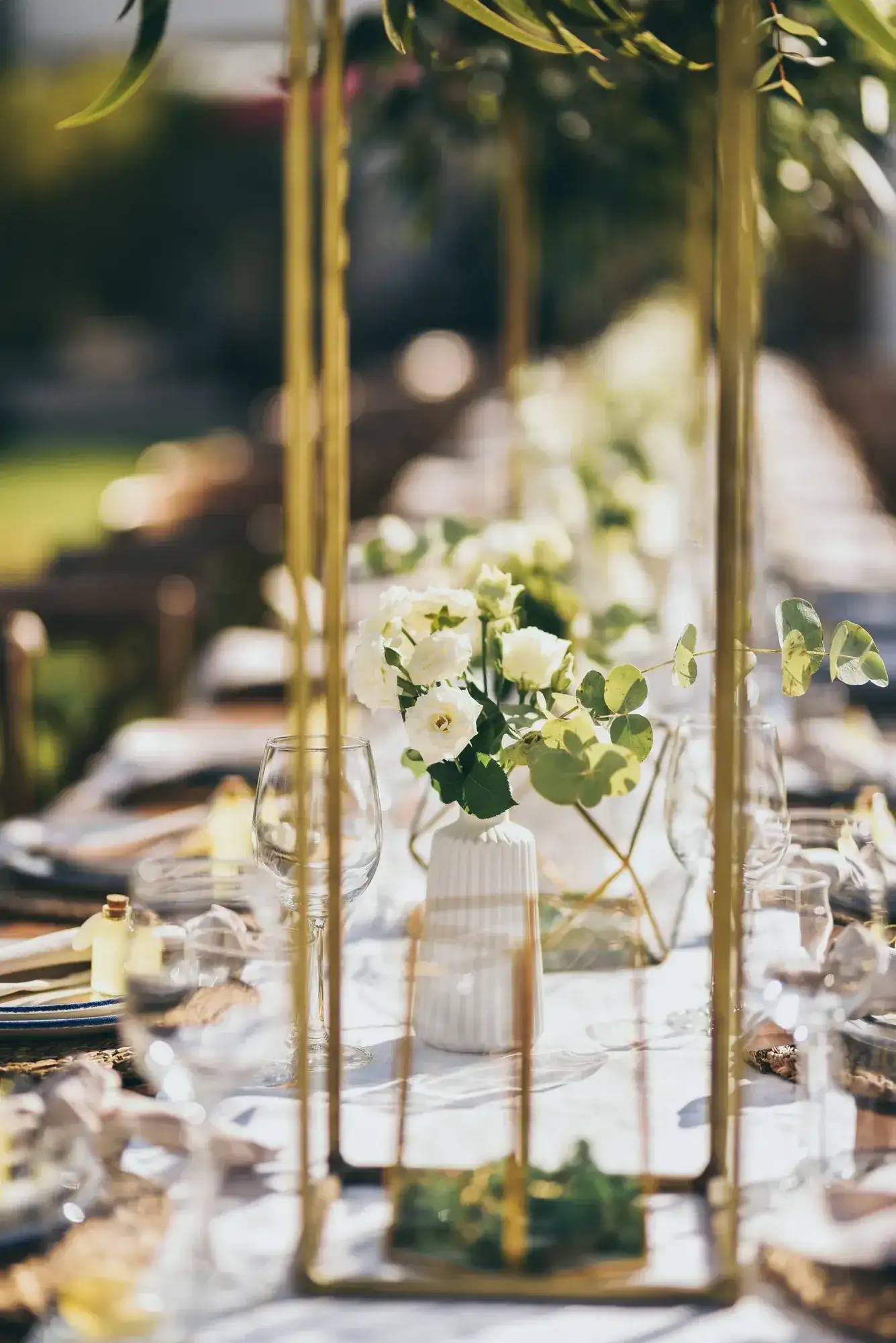 Gold frames and white flowers on the table