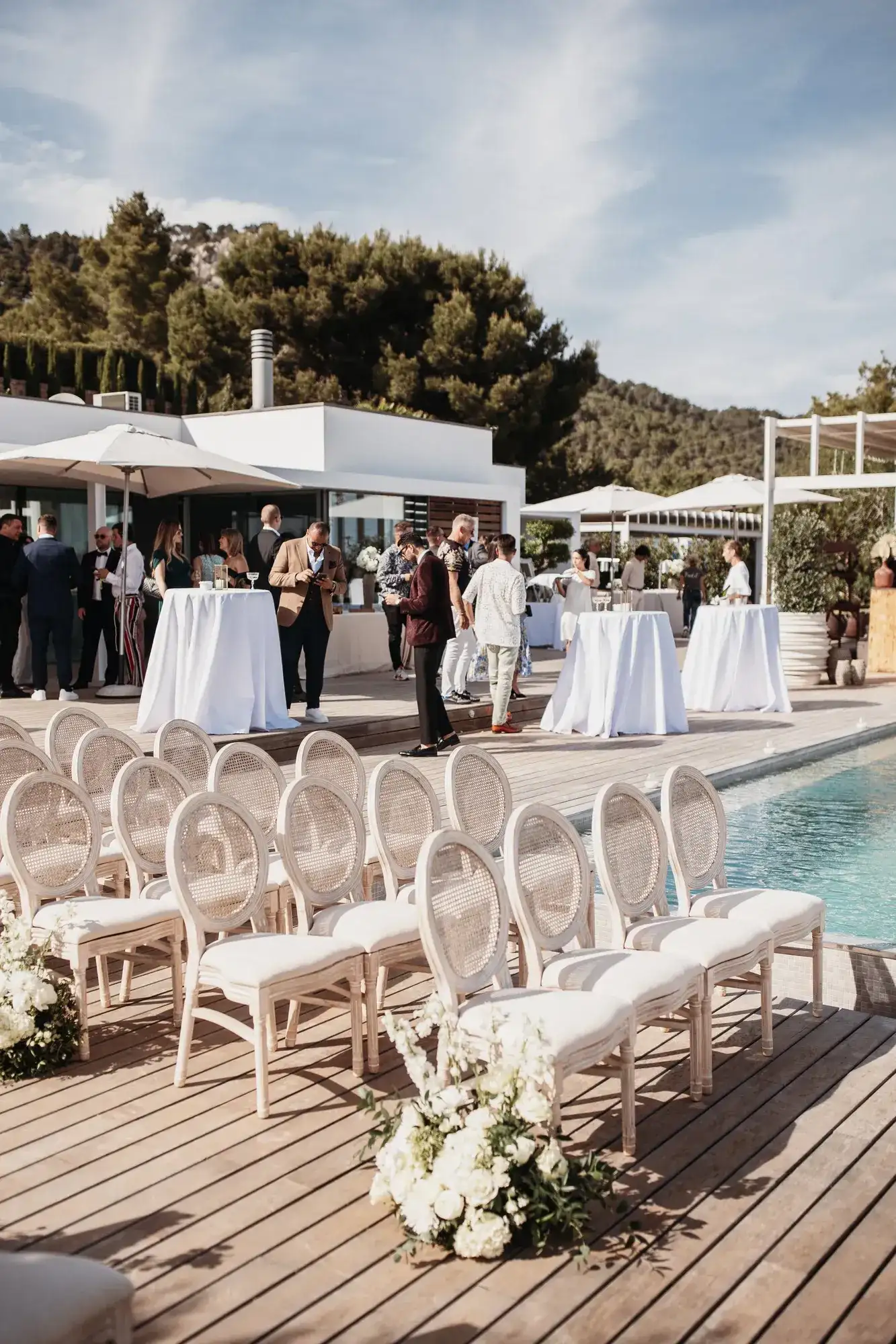 Ceremony chairs on a pool deck