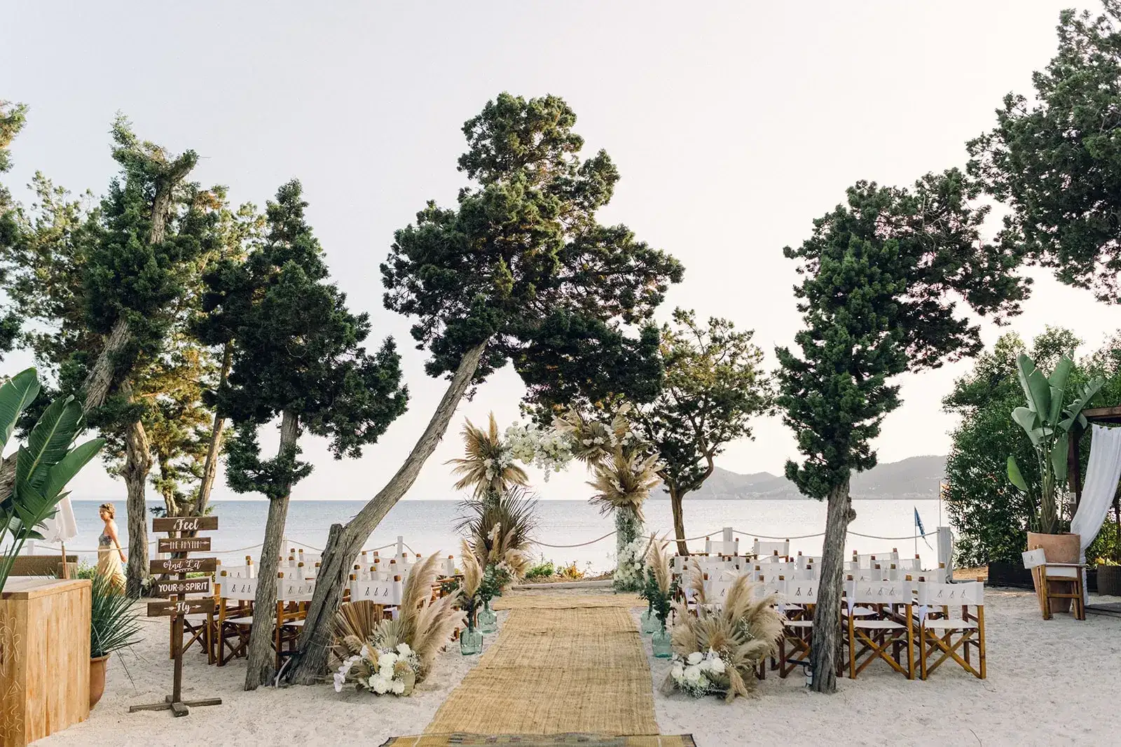 A sandy aisle lined with pampas under the pines, Nikki Beach Ibiza