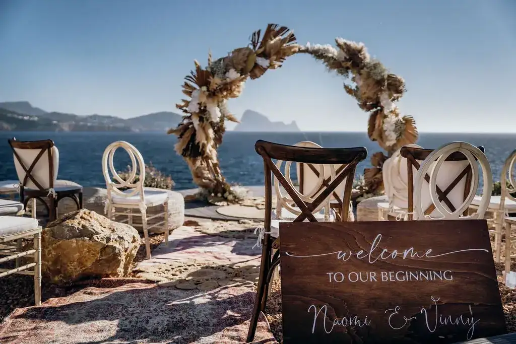 Pampas arch and welcome sign on the clifftop, 7Pines Ibiza