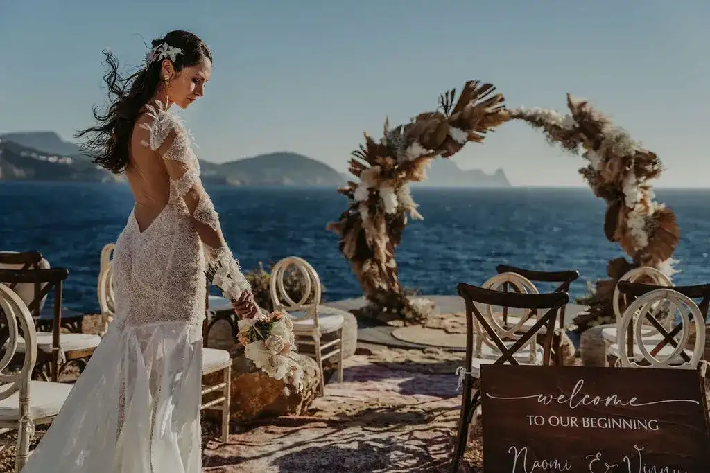 The bride at the pampas arch, 7Pines Ibiza