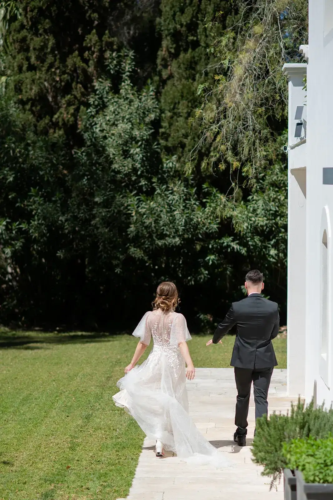 The couple walking through the garden, spring styled shoot