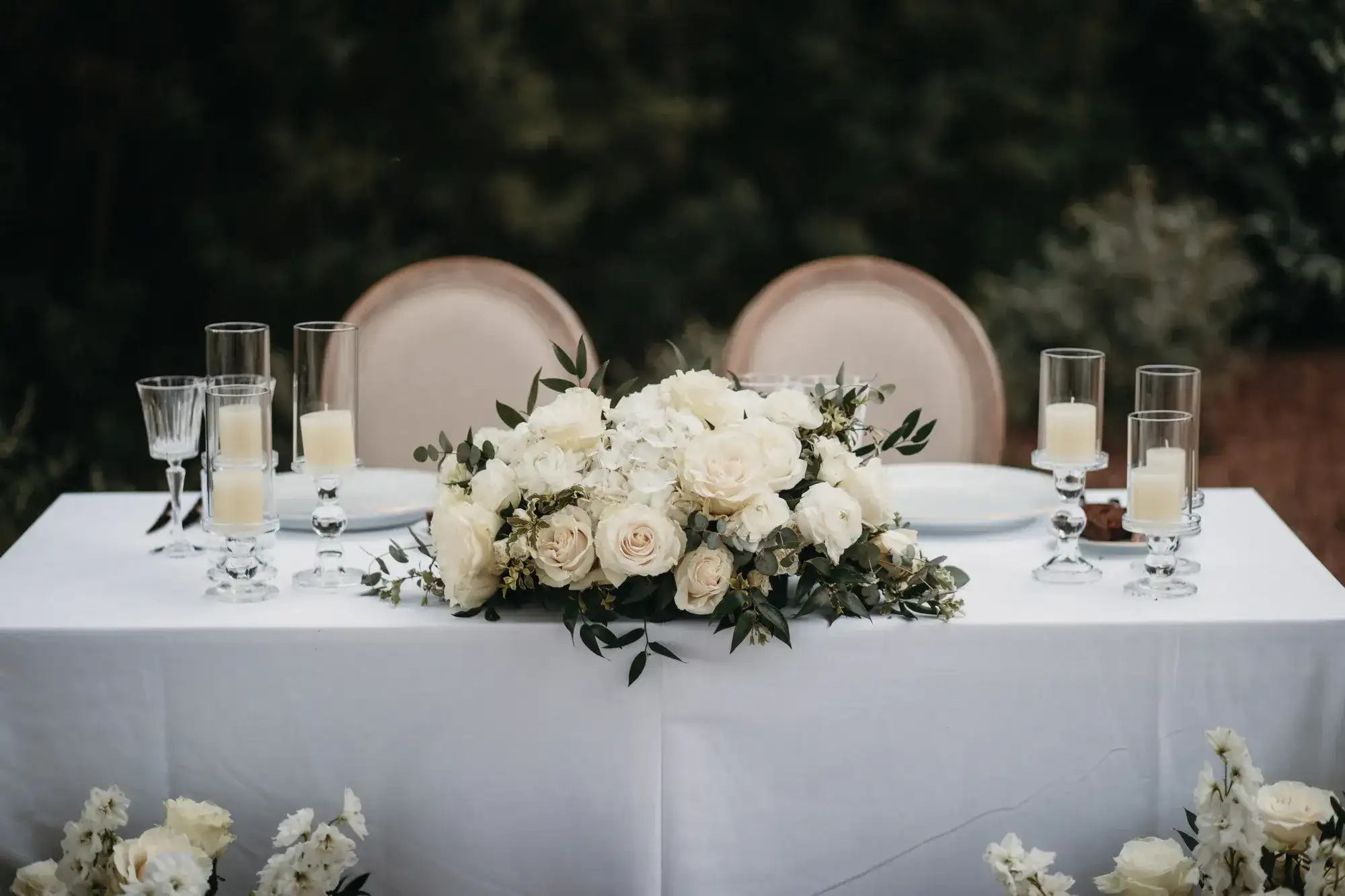Sweetheart table with white roses and candles