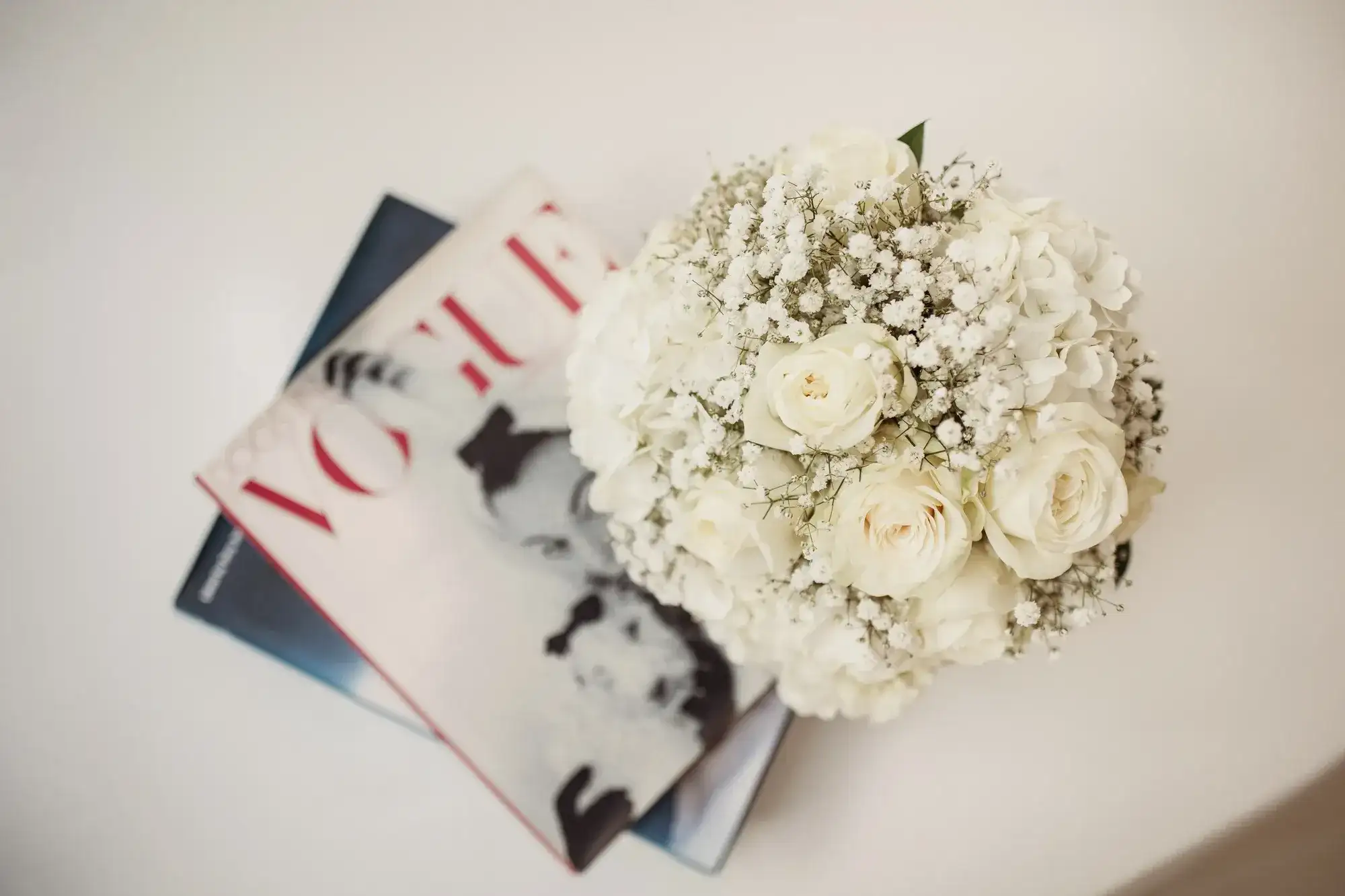 A white bouquet on a fashion magazine