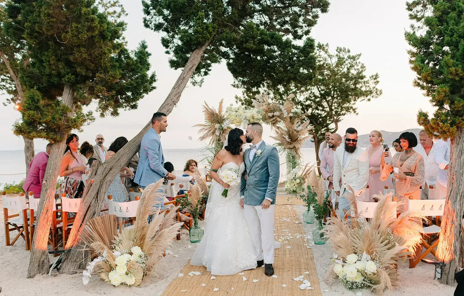 Walking up a pampas-lined aisle on the beach, Nikki Beach Ibiza