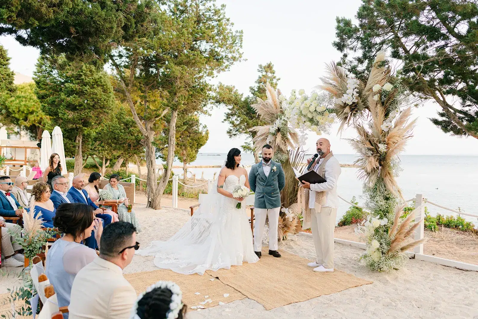 Vows under pampas arches on the beach, Nikki Beach Ibiza