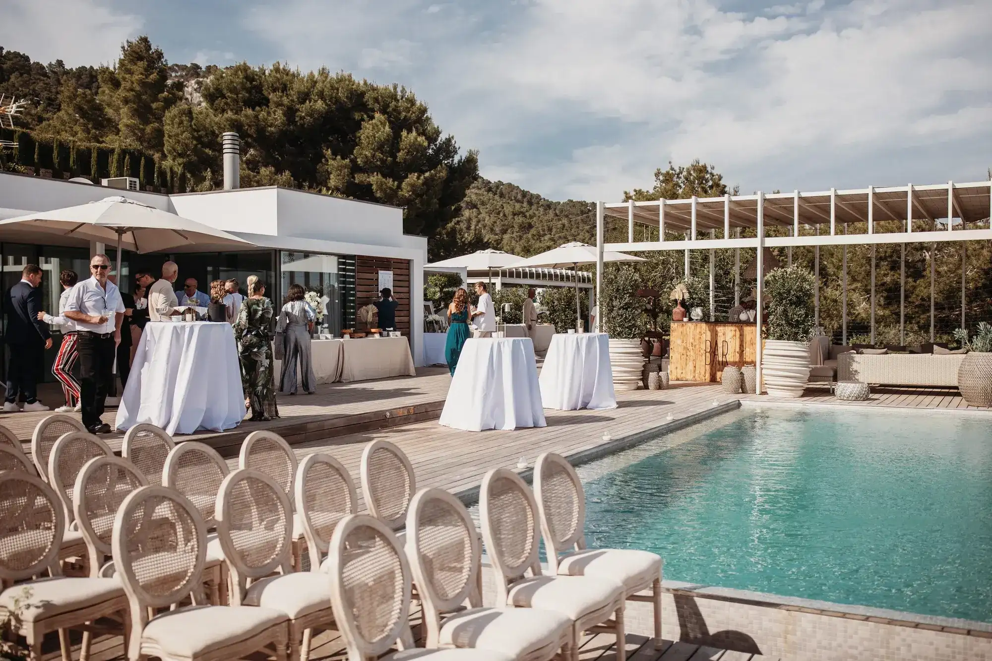 Ceremony chairs beside the pool