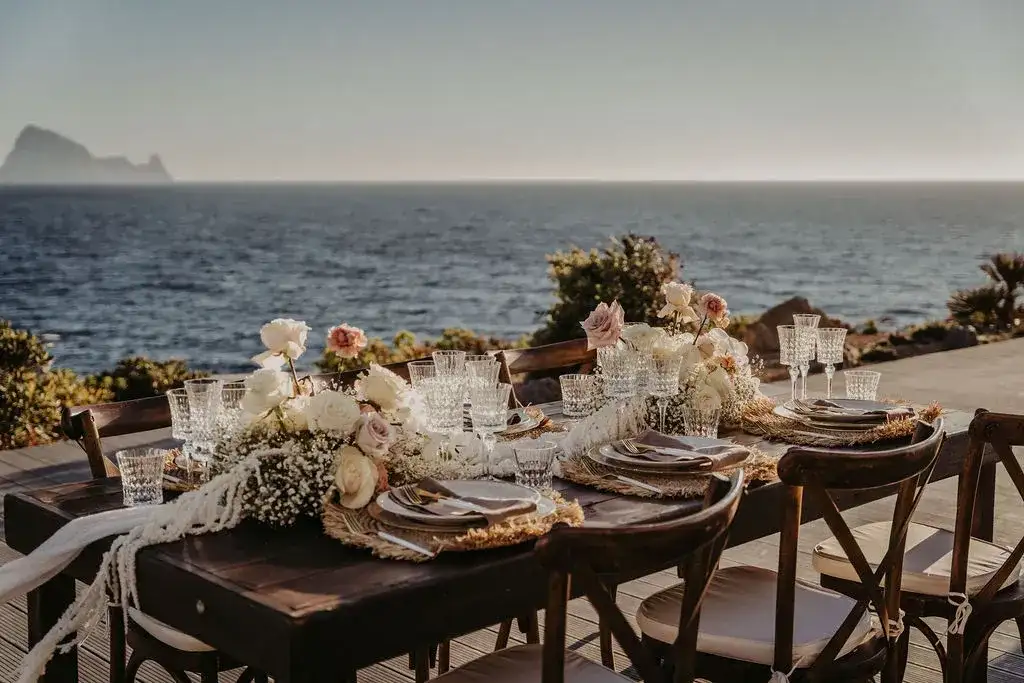 Tables set on the clifftop above the sea, 7Pines Ibiza