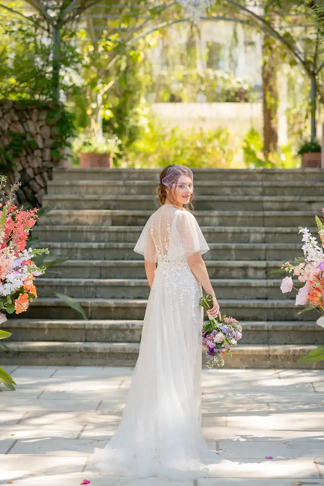The bride on the garden steps, spring styled shoot