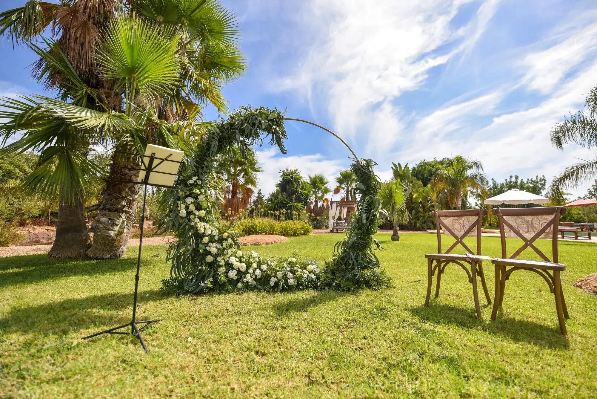 A green hoop arch on the lawn