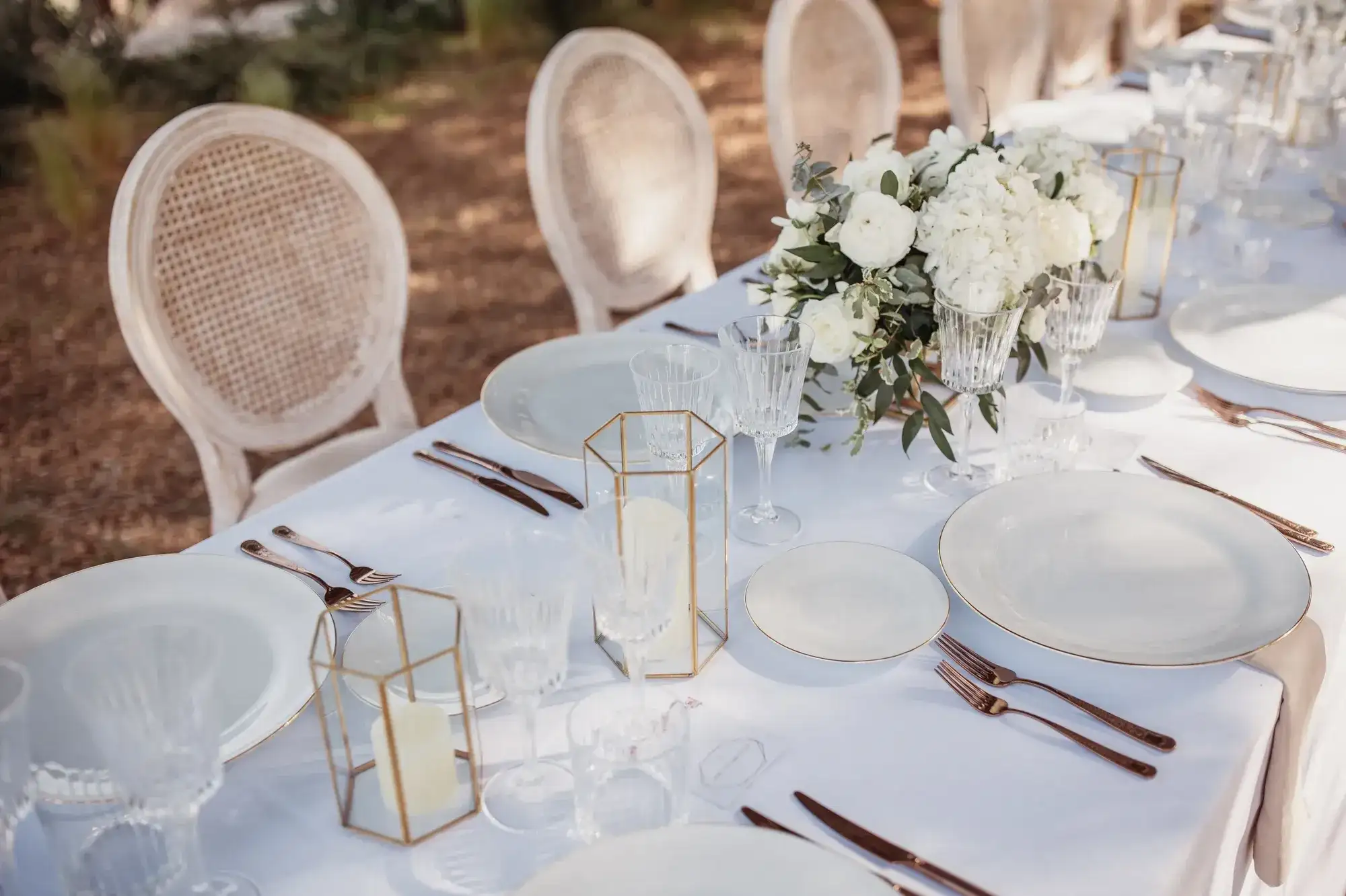 A white table with gold lanterns