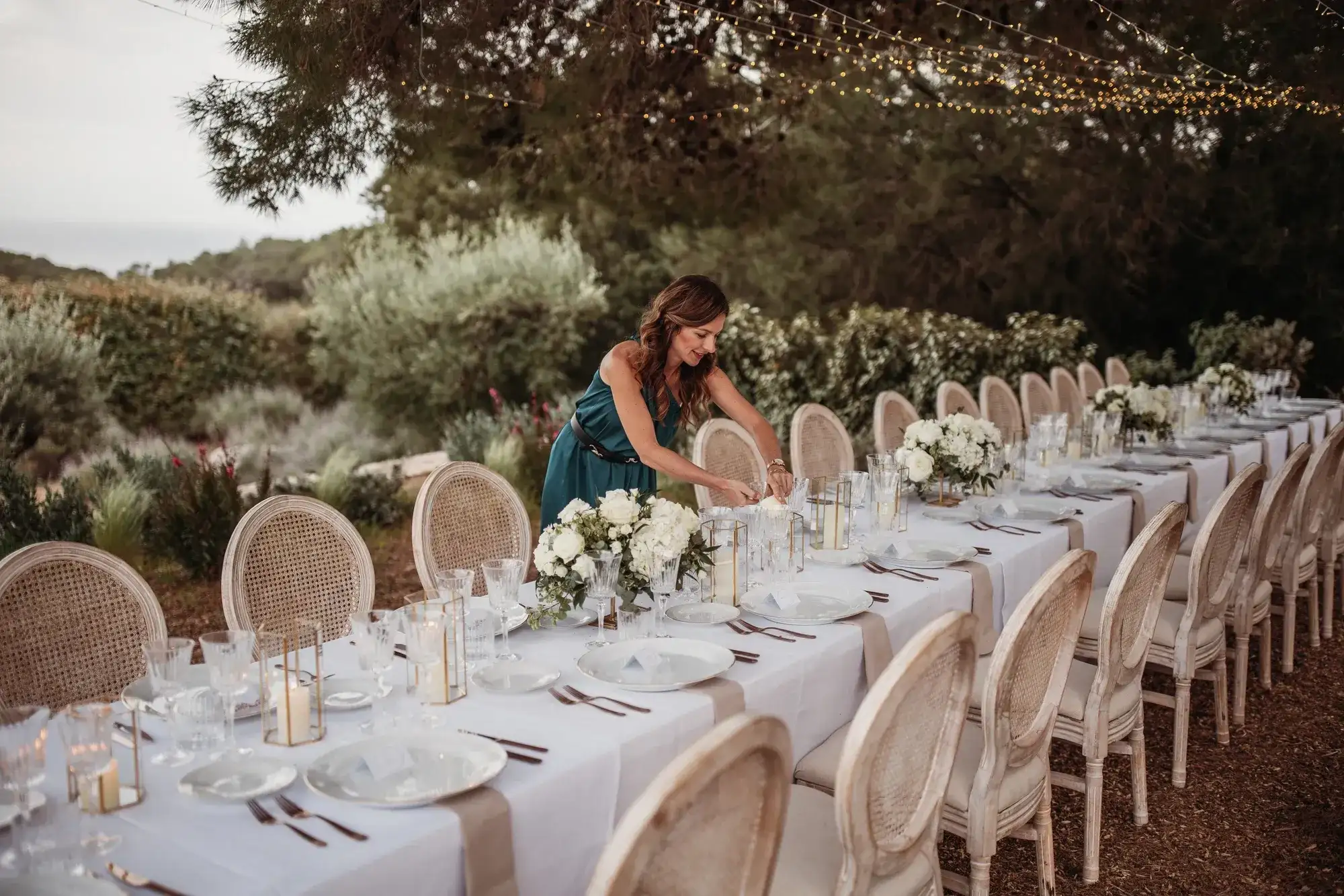 Setting a long table above the olive groves