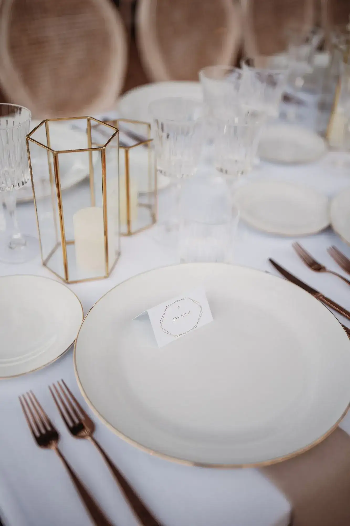 White china, a gold lantern and a place card