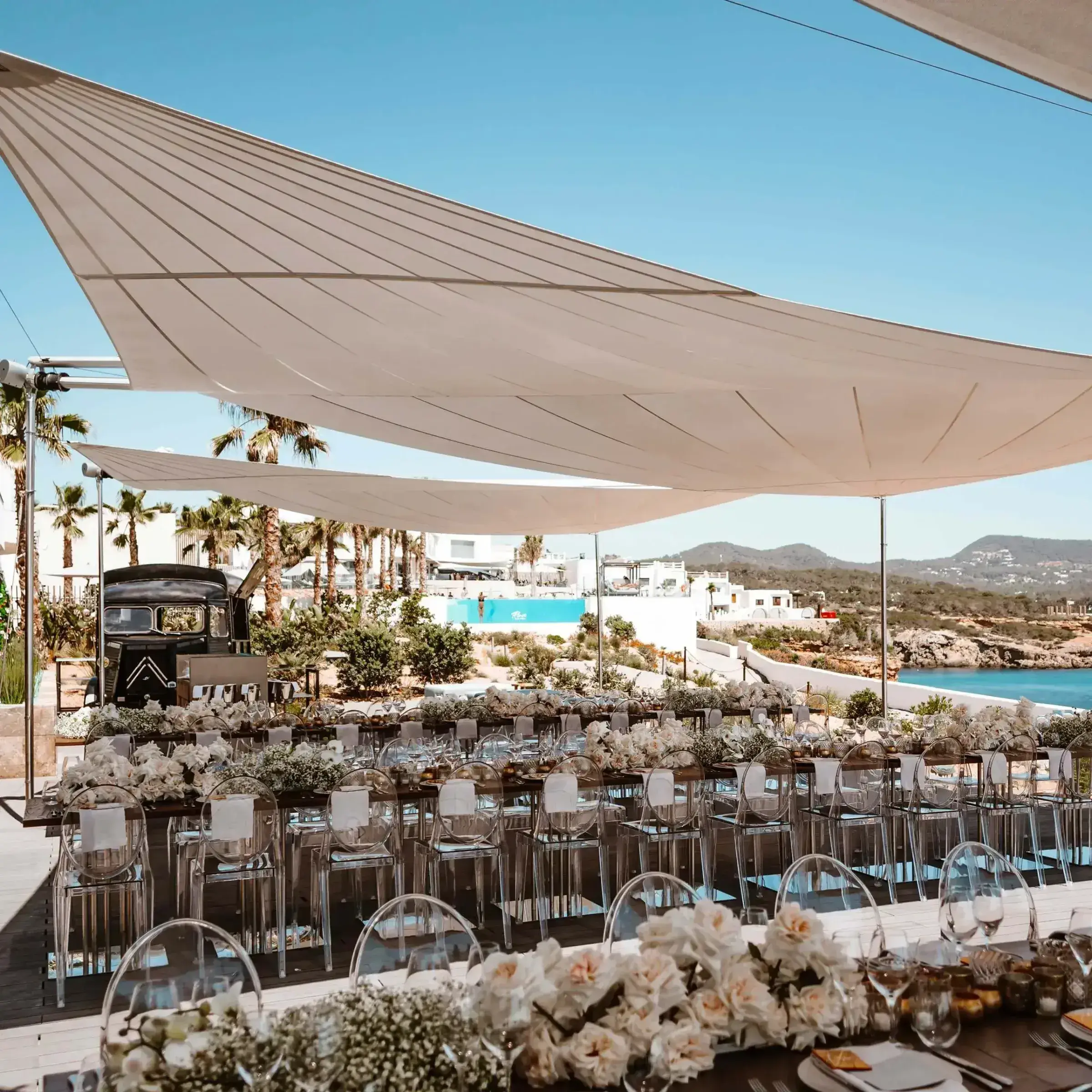 7Pines Resort Ibiza: Long dinner tables laid on a terrace under white sails