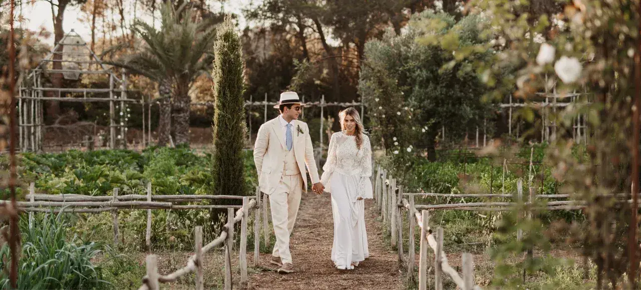 Agroturismo Atzaró: Couple walking through the estate's vegetable garden