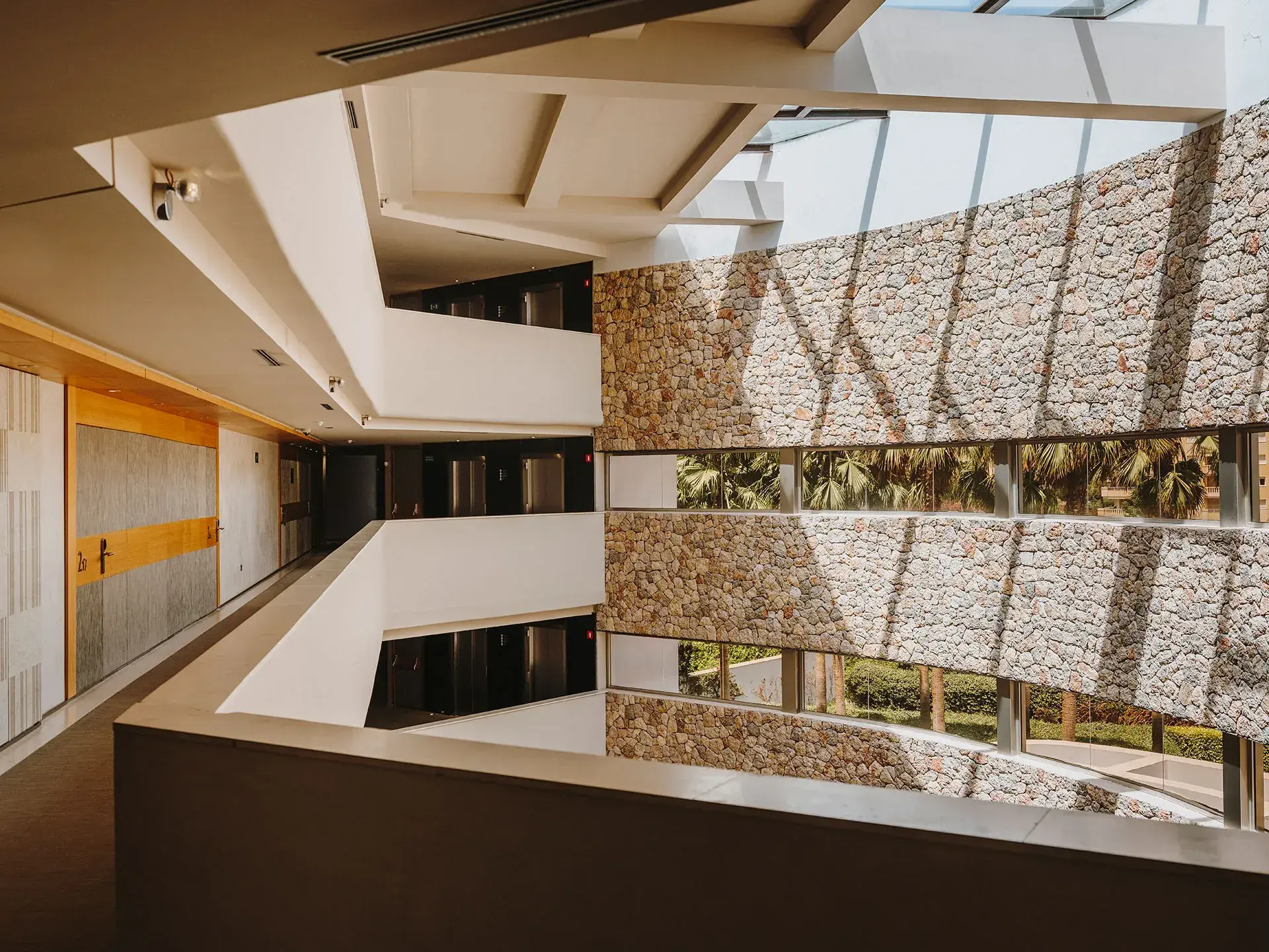 Aguas de Ibiza: Atrium with curved dry-stone walls and open walkways