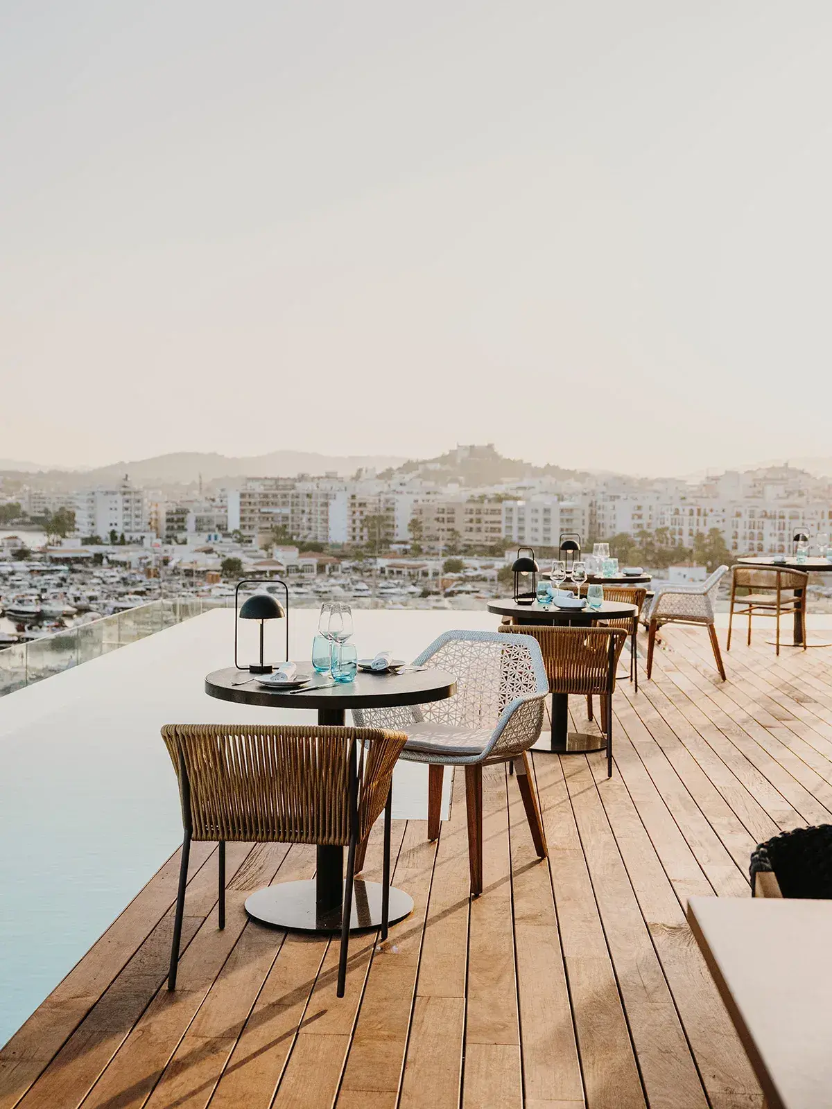 Aguas de Ibiza: Rooftop dining deck with tables over the marina