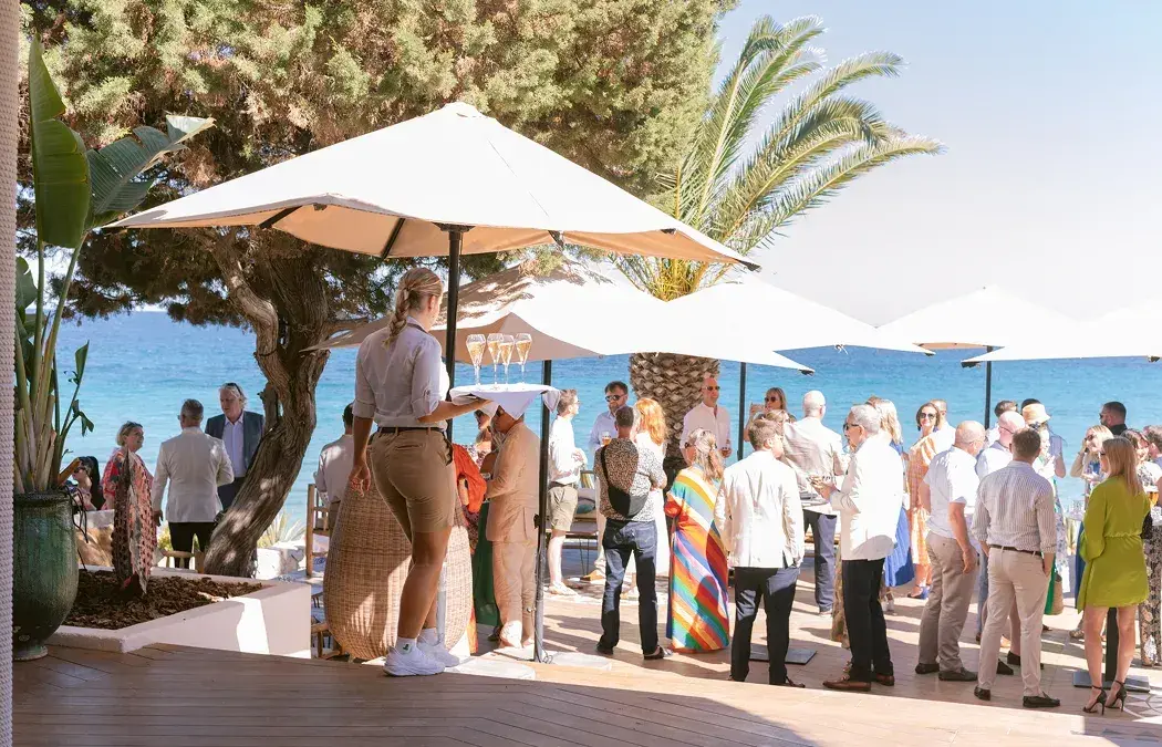 Aiyanna Ibiza: Wedding guests gathered on the terrace under white parasols