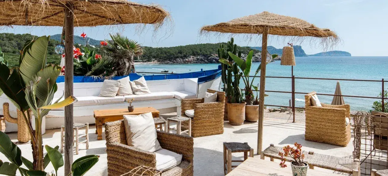 Atzaró Beach: Seating area with thatched parasols and a sea view