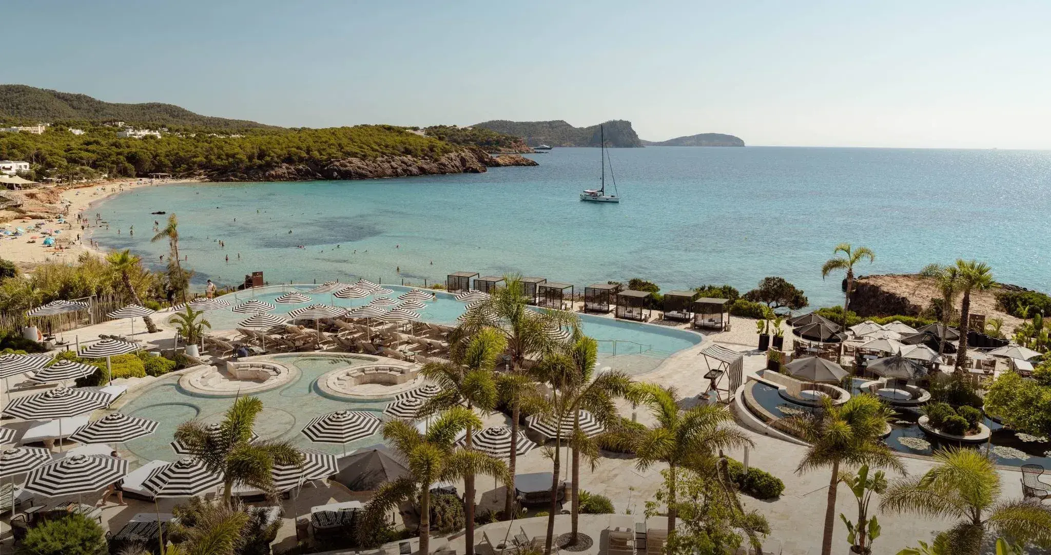 Bless Hotel Ibiza: Aerial view of the hotel pools and Cala Nova beach