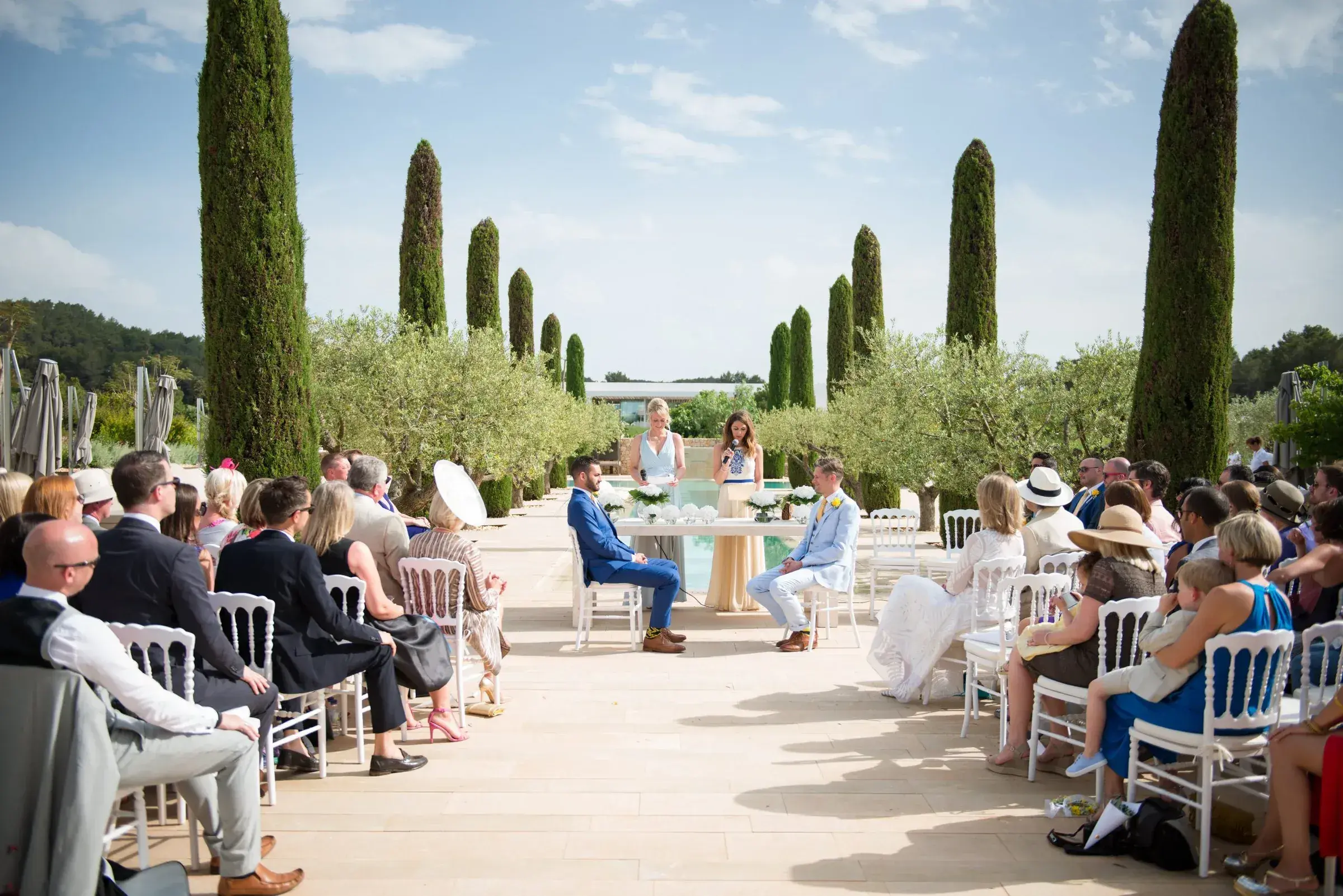 Ca Na Xica: Couple at the end of the cypress-lined pool walk