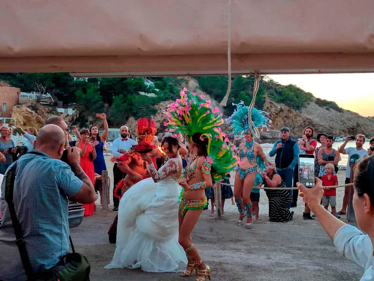 Cana Sofía: Bride dancing with carnival performers at the reception