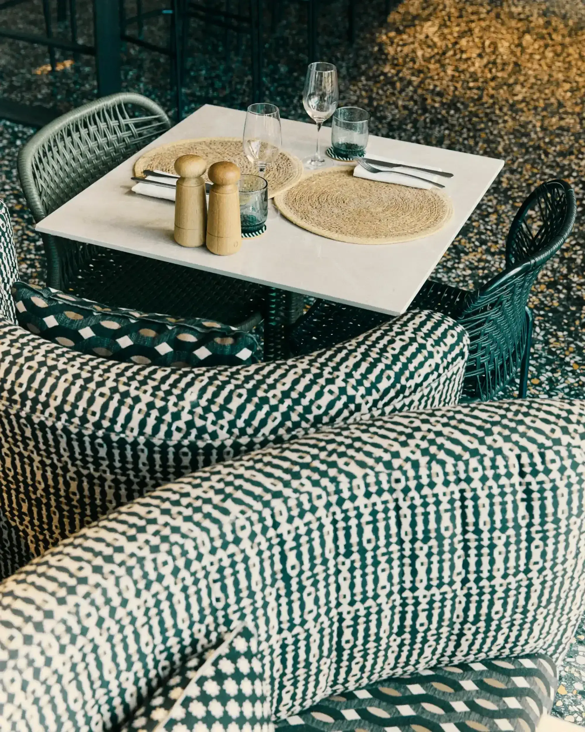 Experimental Beach: Terrace table with patterned cushions