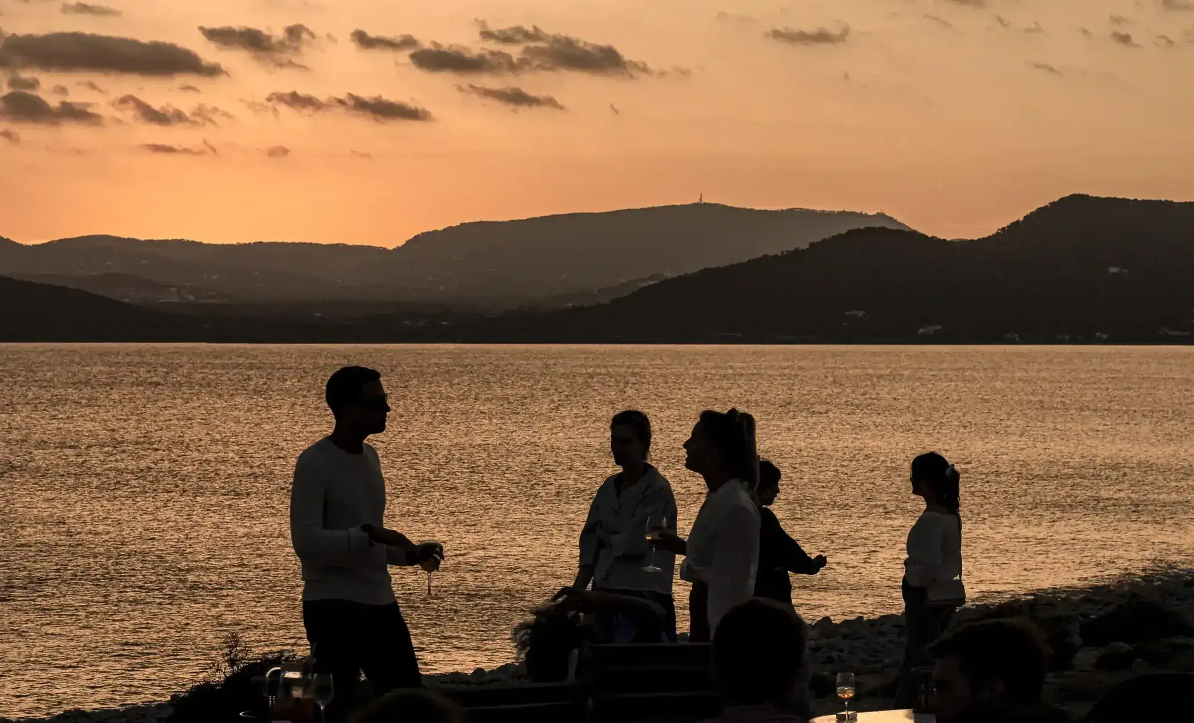 Experimental Beach: Sunset over the bay and hills seen from the beach club