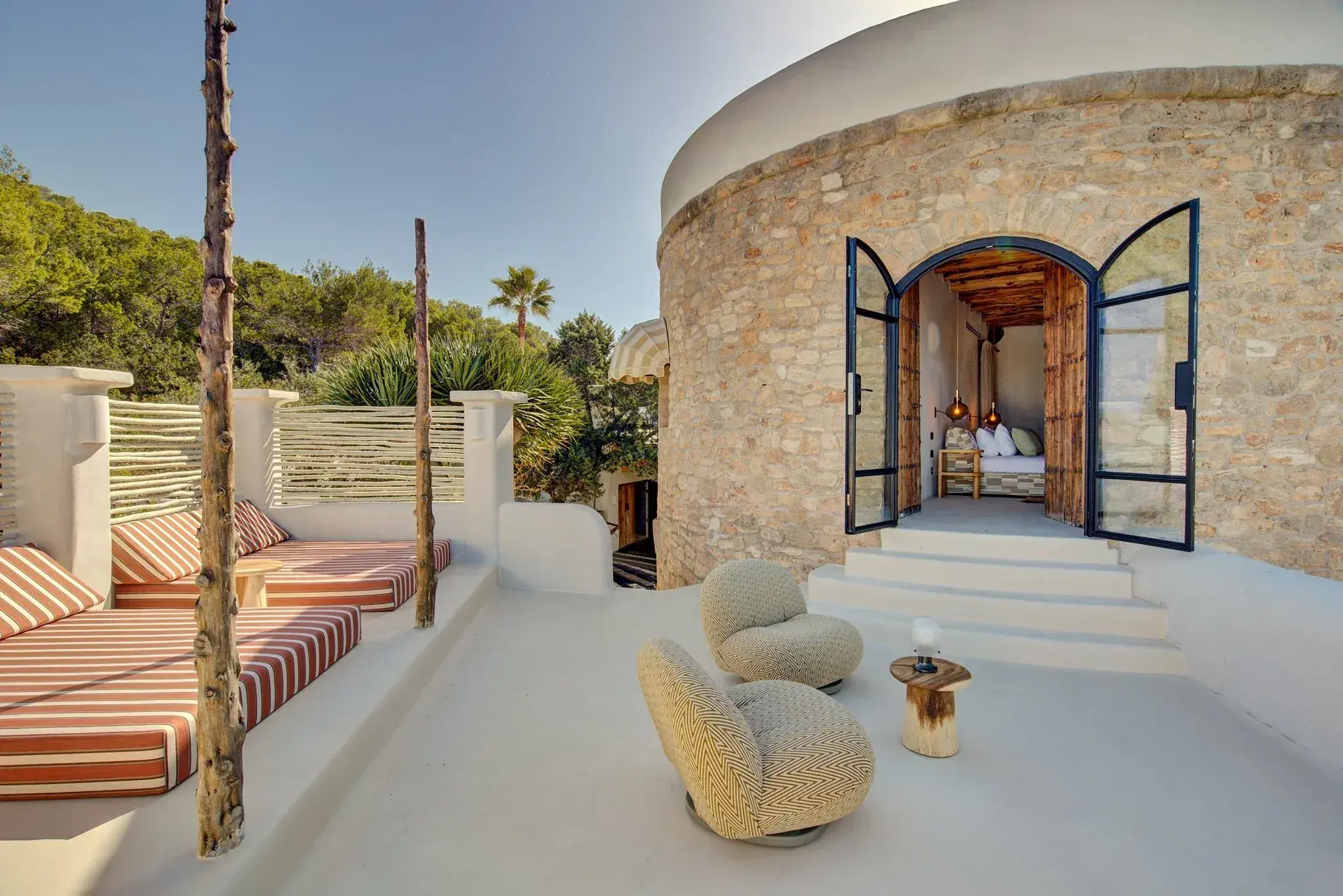Fincadelica Xarraca: Stone tower suite opening onto a terrace above the cove