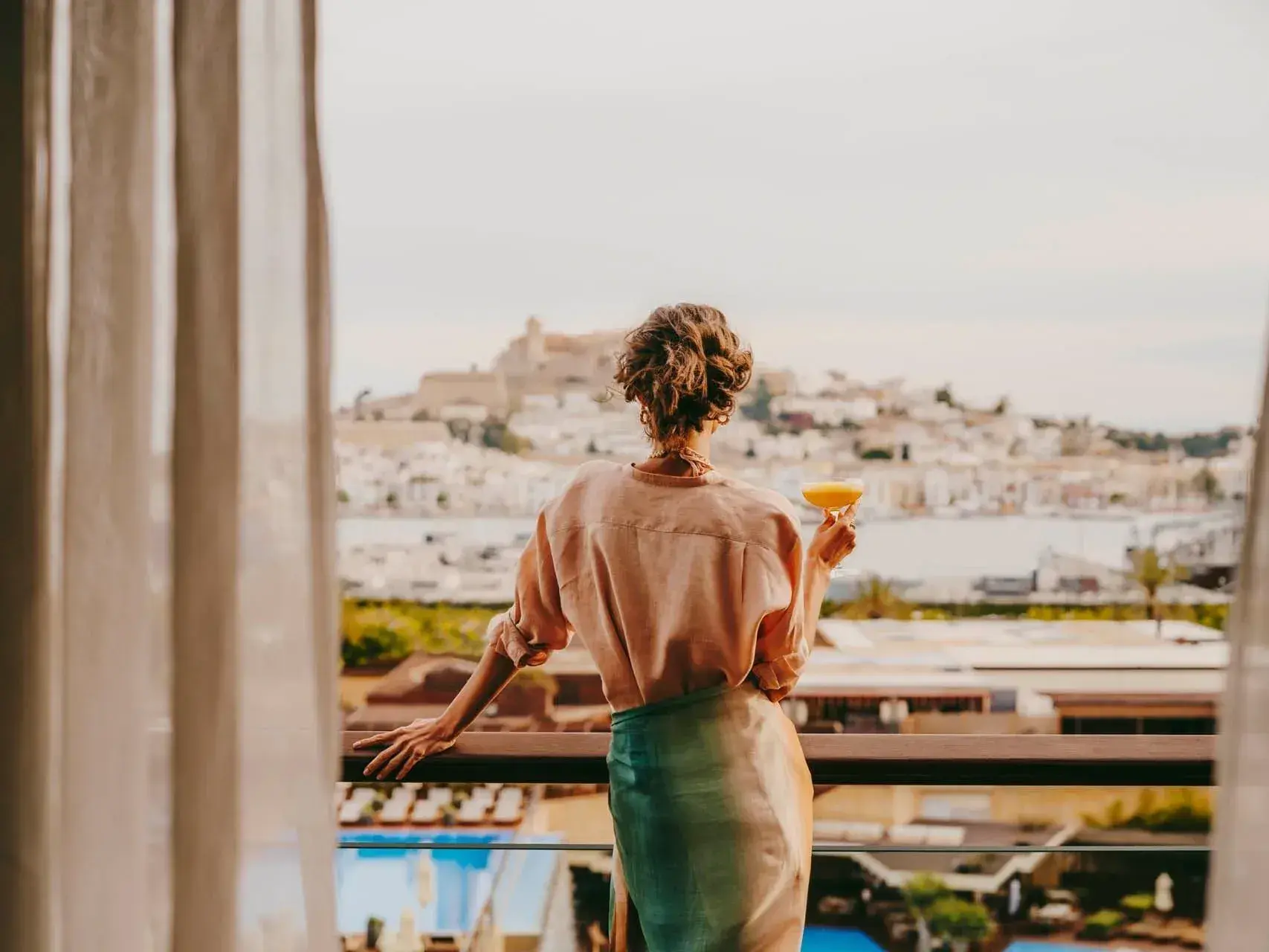 Ibiza Gran Hotel: Guest on a balcony looking across the marina to Dalt Vila