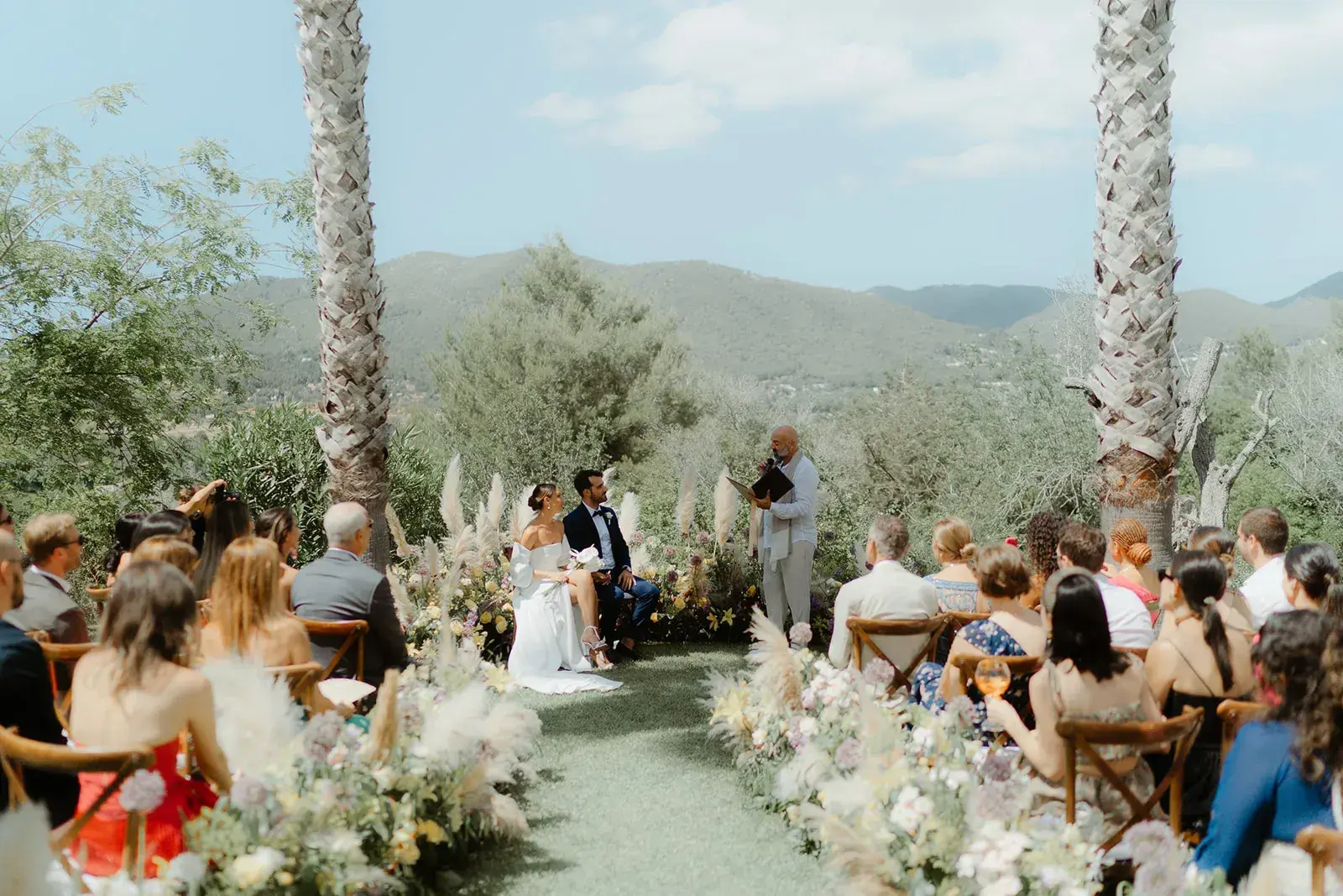An olive-grove ceremony with the hills beyond, Can CG