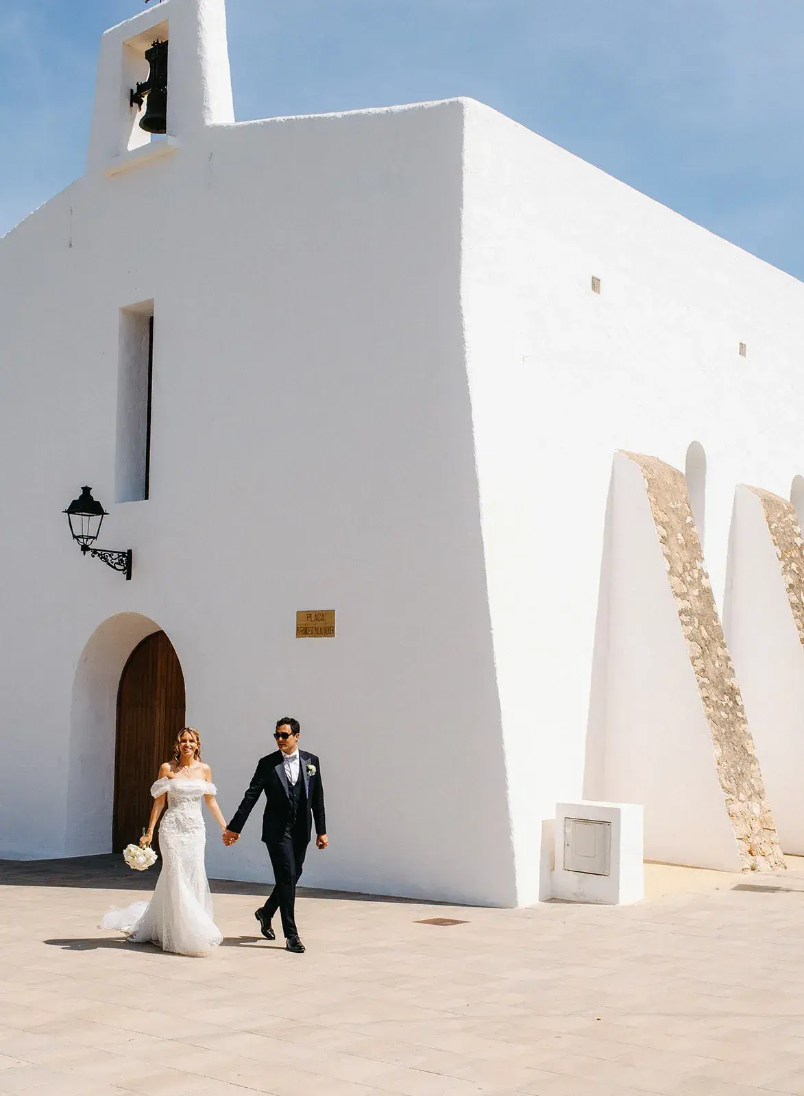 Leaving a whitewashed Ibiza church, Atzaró