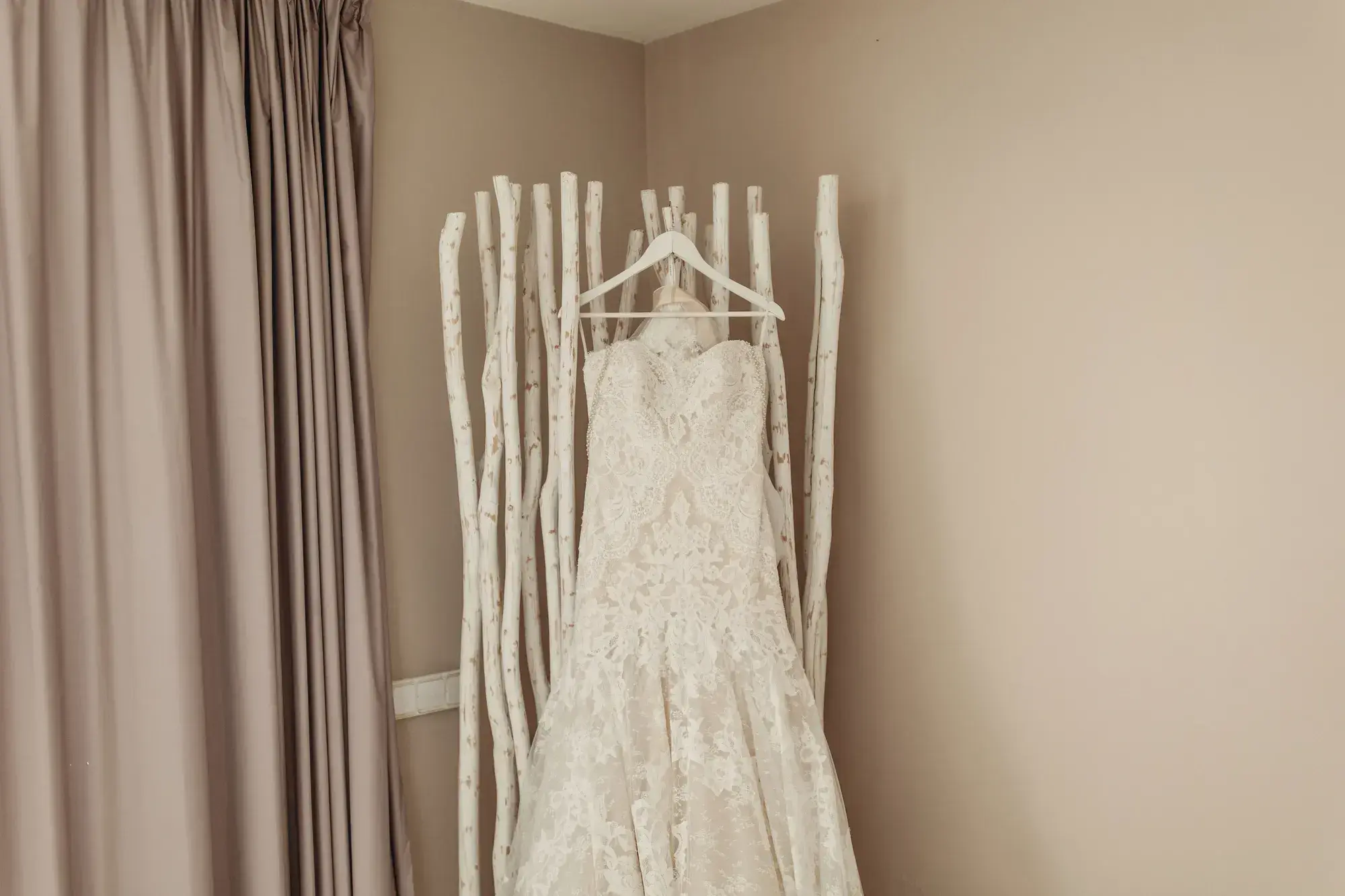 The lace dress hanging in the bedroom