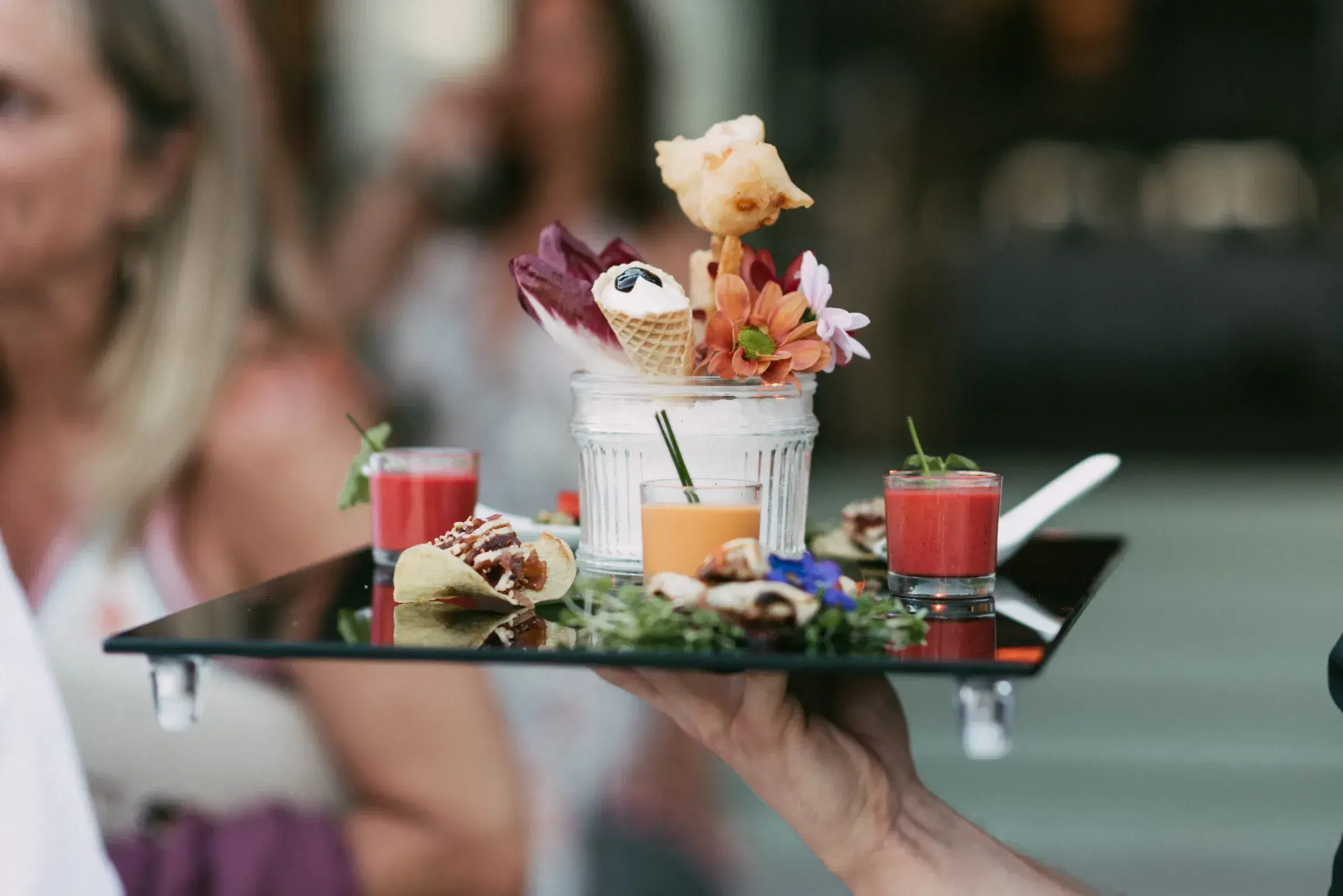 La Escollera: Tray of canapés and shots served to guests at an event