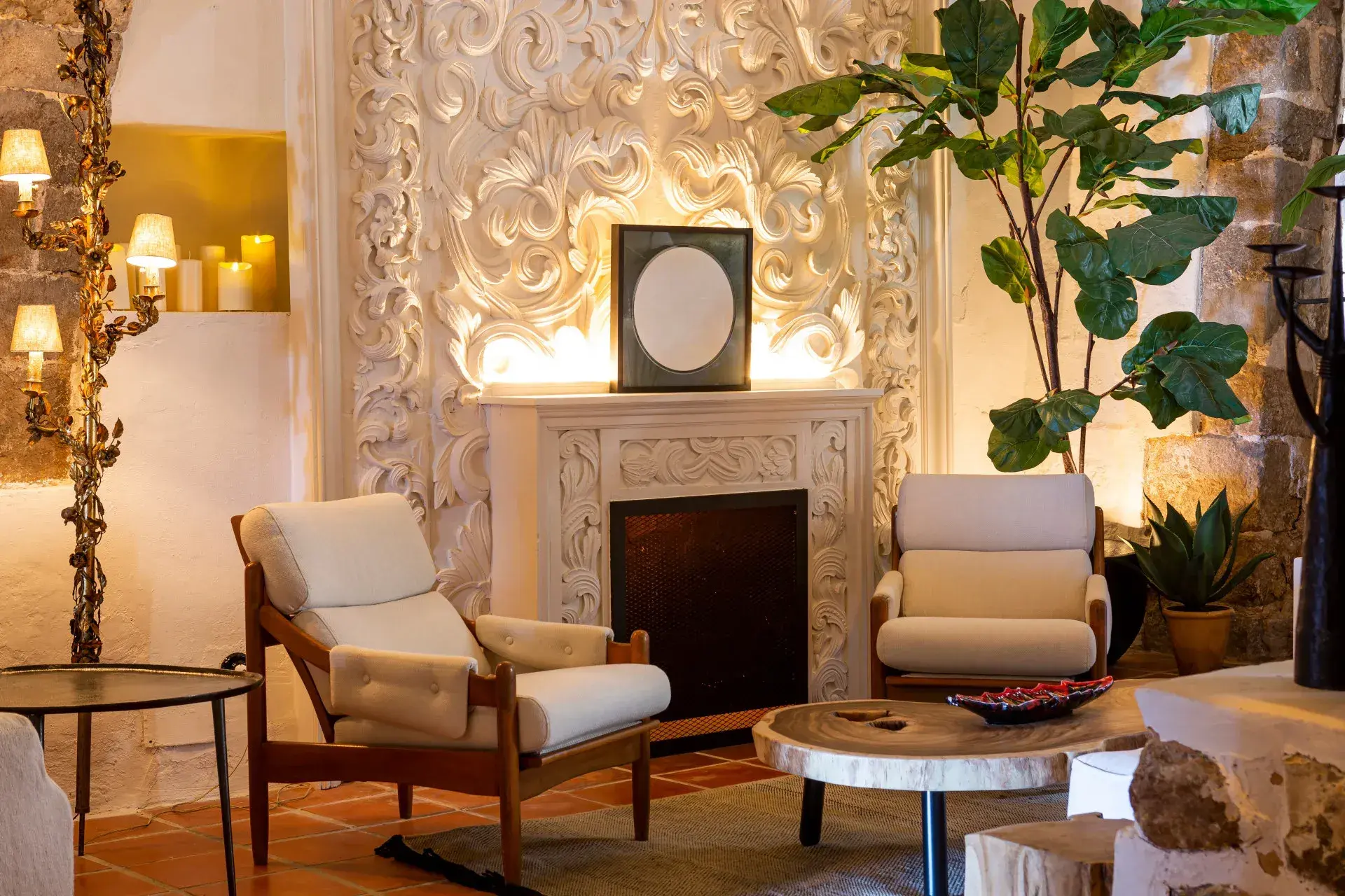 La Torre del Canónigo: Sitting room with carved fireplace wall and armchairs