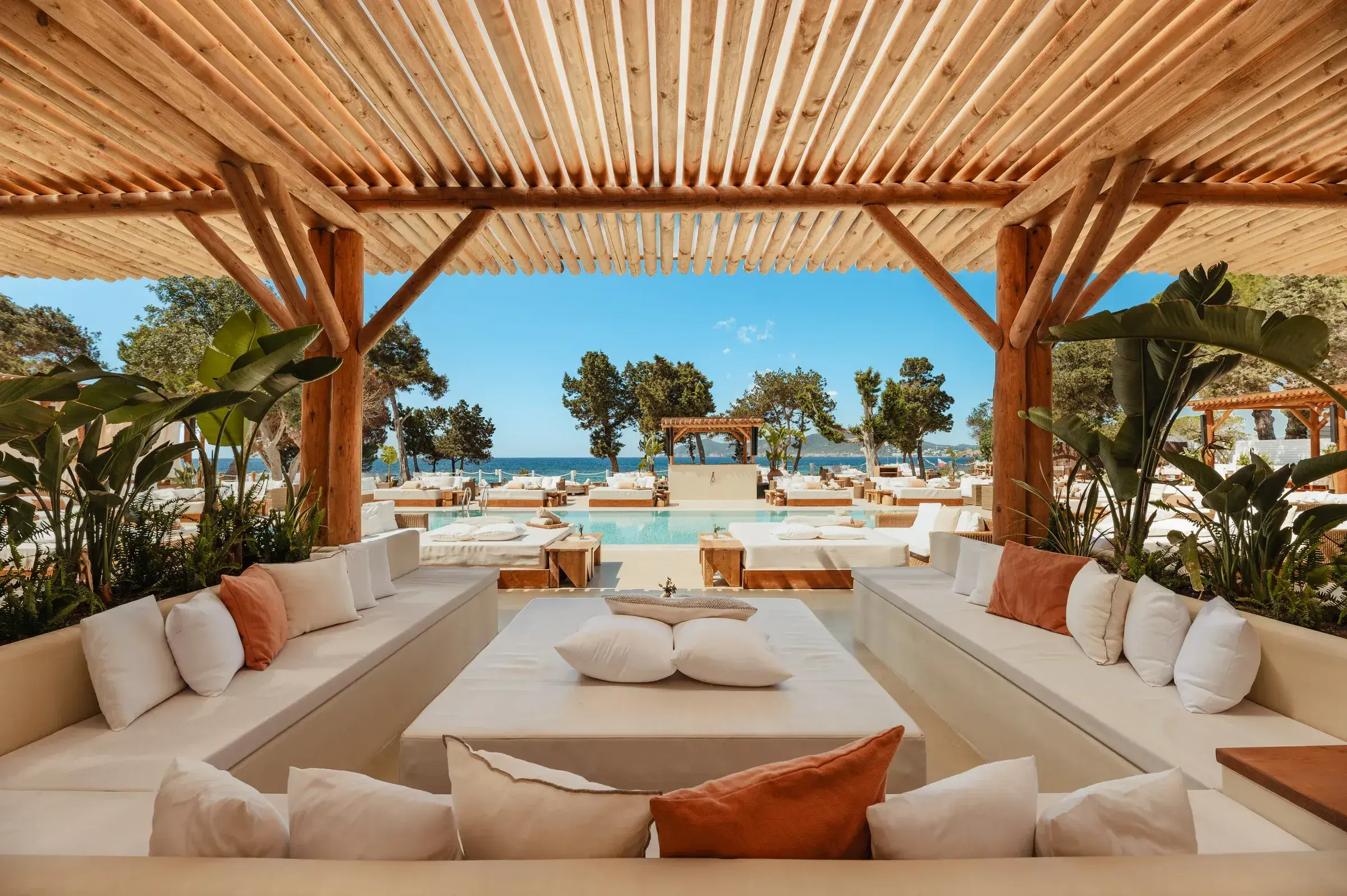ME Ibiza: Pergola lounge with sunken sofas looking toward the pool and sea