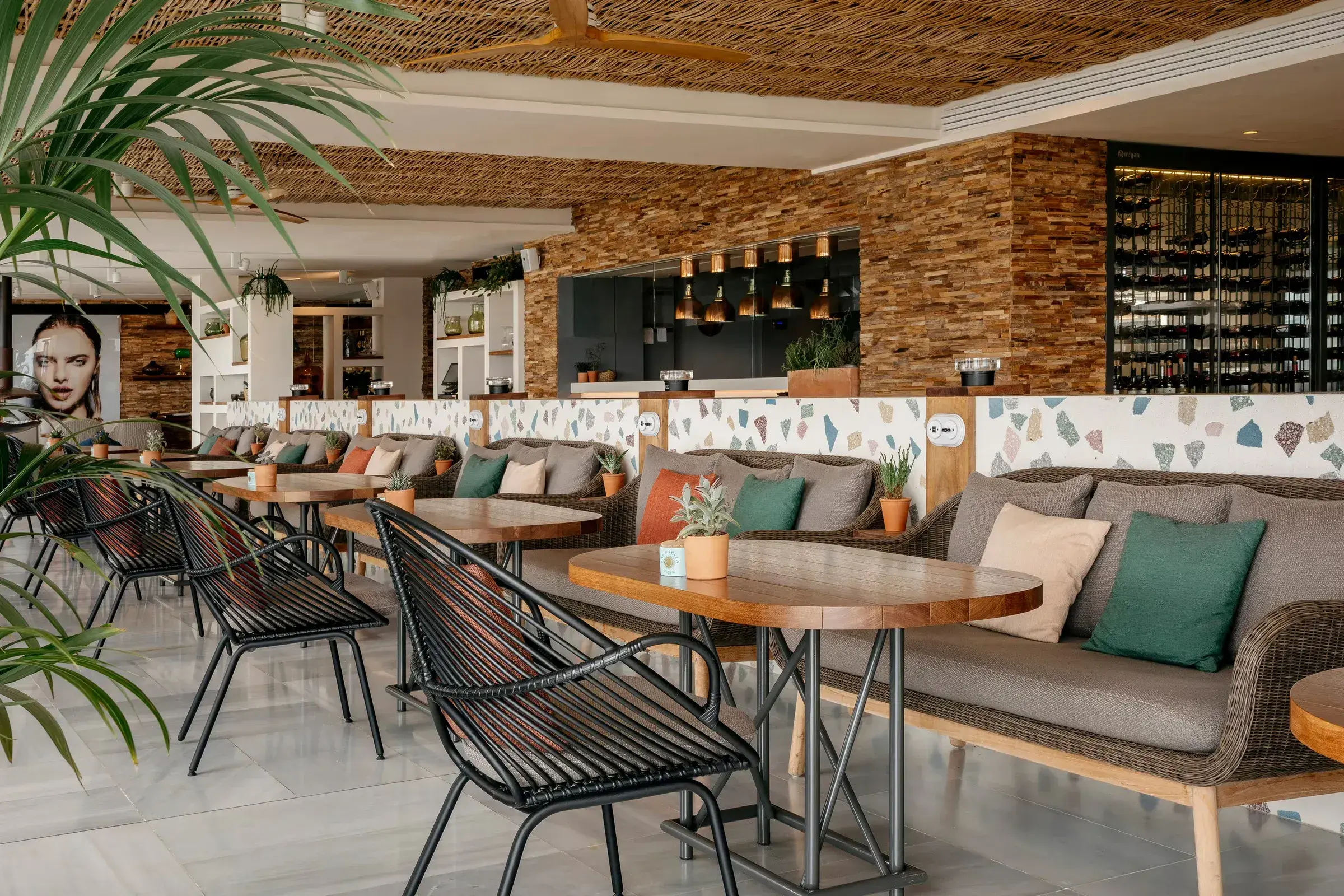 ME Ibiza: Restaurant lounge with brick wall and woven chairs