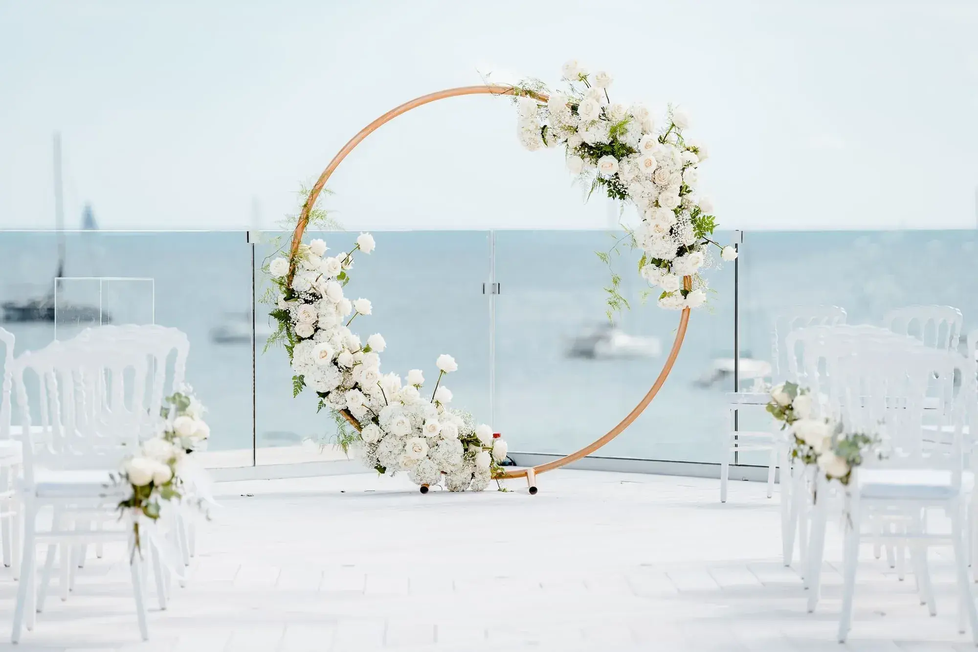 Nobu Hotel Ibiza Bay: Round floral arch and white chairs on the rooftop facing the bay