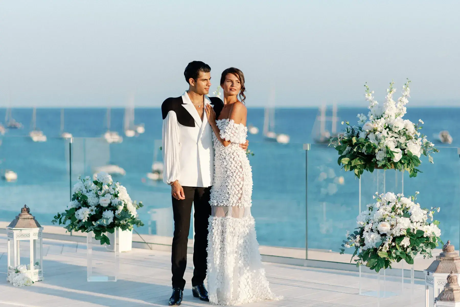 Bride and groom on the terrace above the bay at Nobu Hotel Ibiza Bay