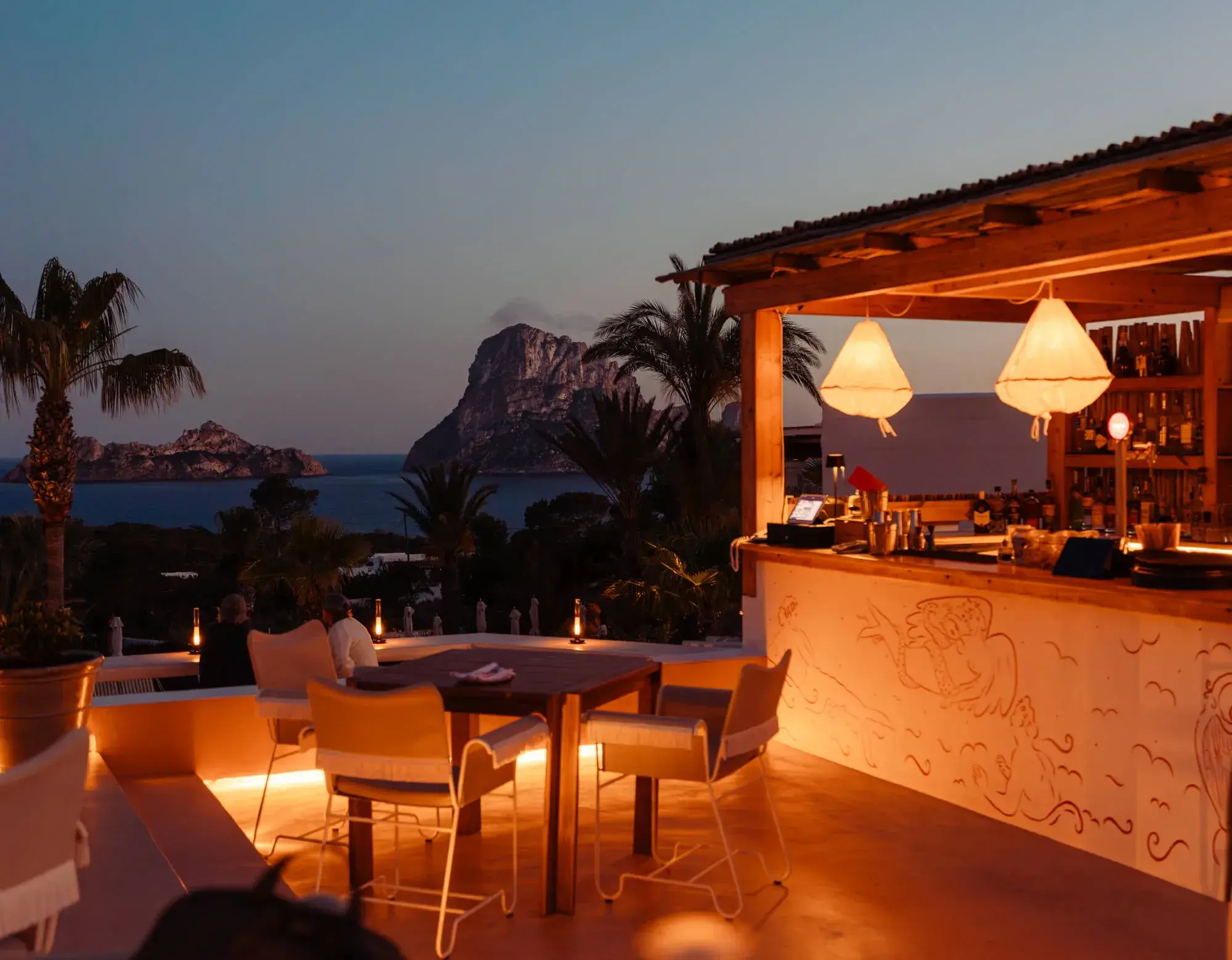 Petunia Ibiza: La Mirada rooftop bar and terrace at dusk with Es Vedrà