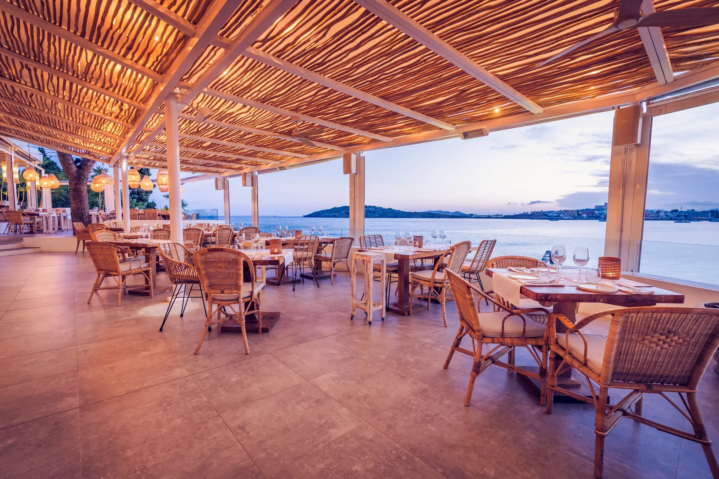Sa Punta: Main restaurant terrace under a reed roof overlooking Talamanca bay