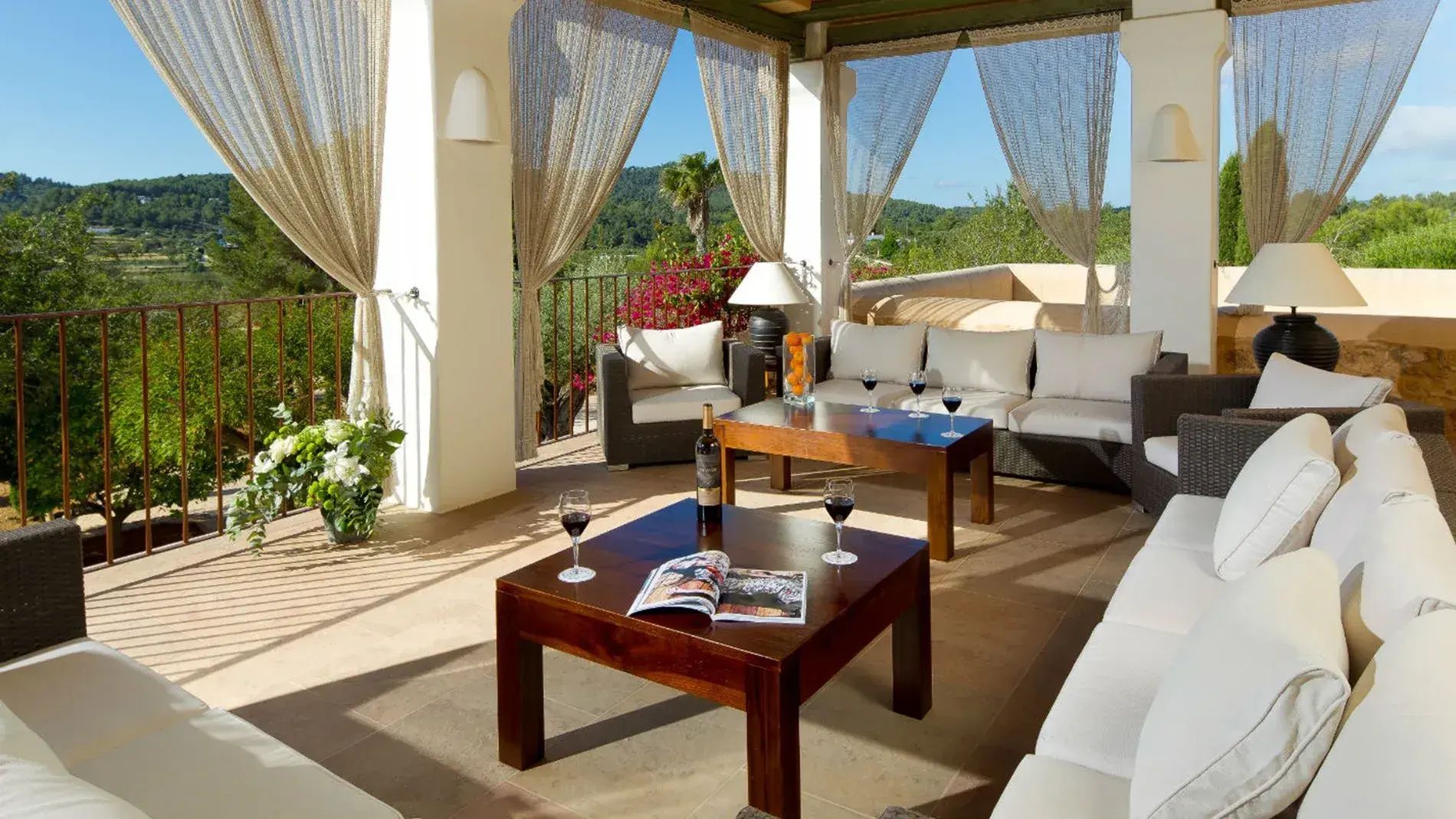 Villa Alex: Porch lounge with white sofas and curtains