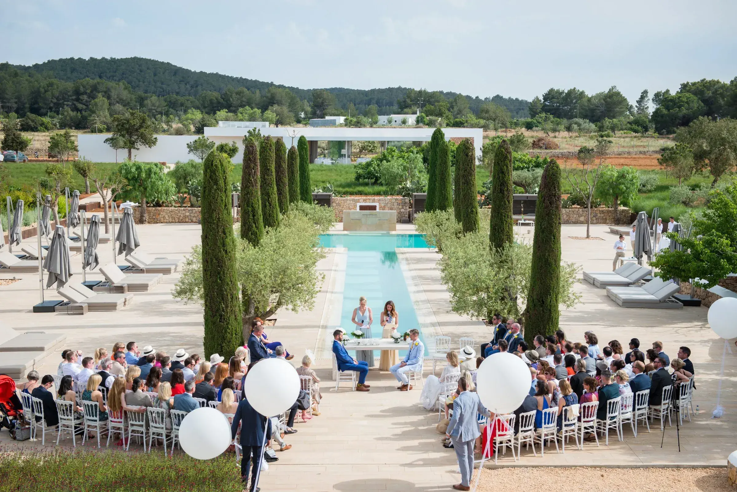 Ca Na Xica: Ceremony set up at the end of the pool, seen from above with the countryside behind