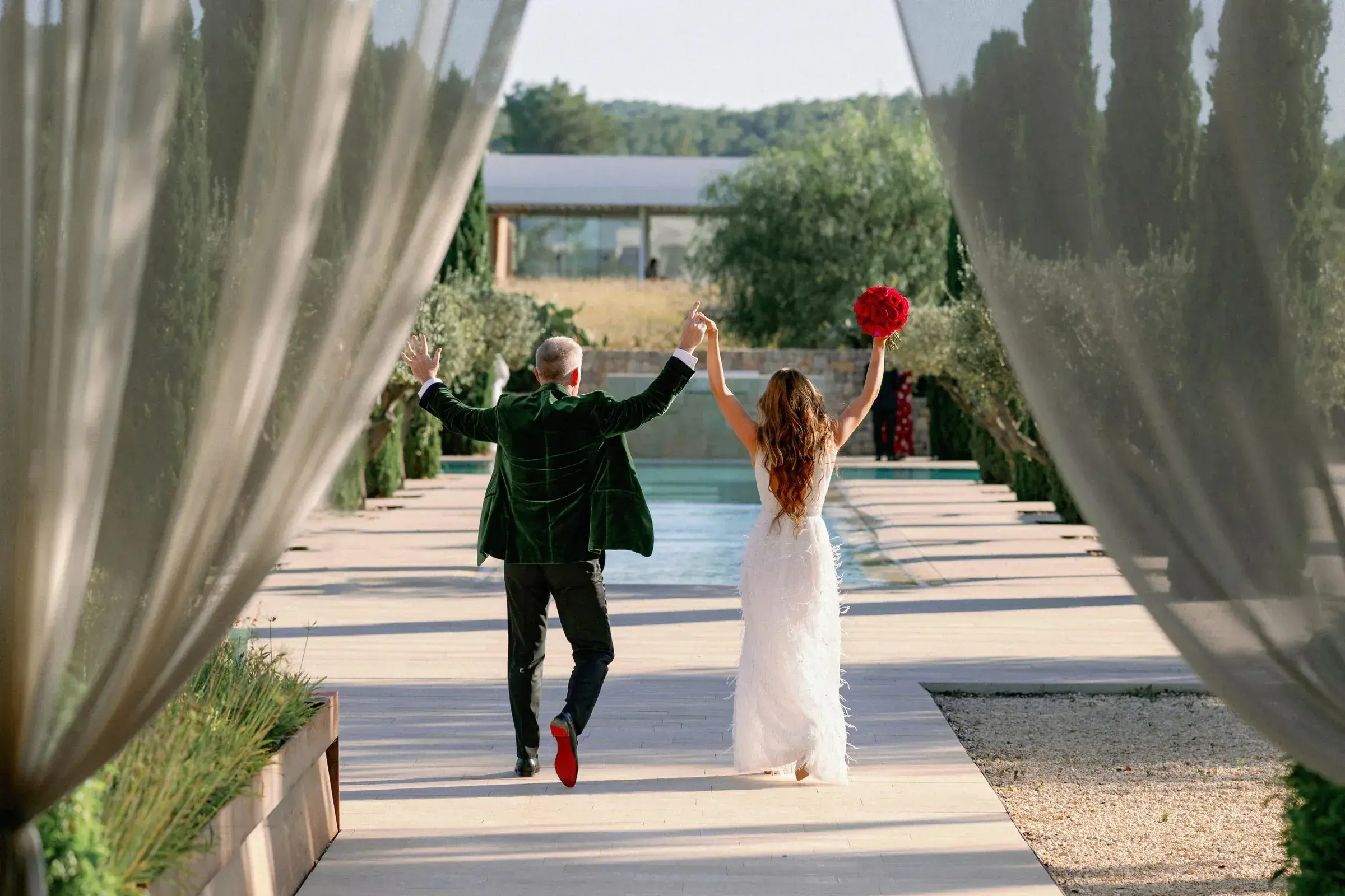 Ca Na Xica: Couple celebrating by the pool between white drapes