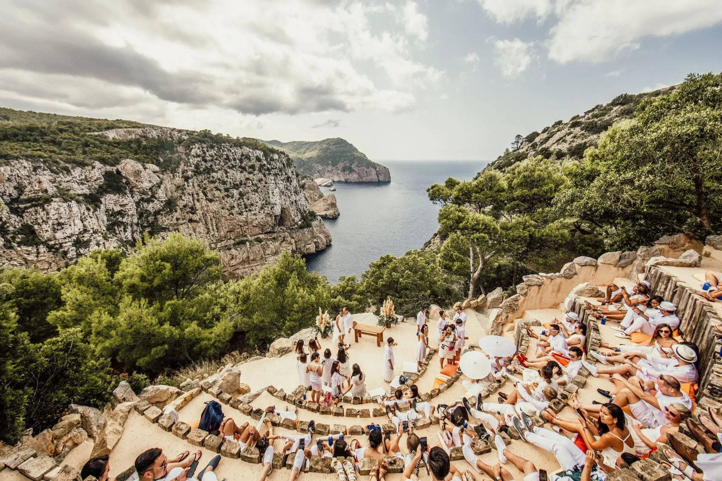 Hacienda Na Xamena: Ceremony in the clifftop amphitheatre, seen from above with the coast behind