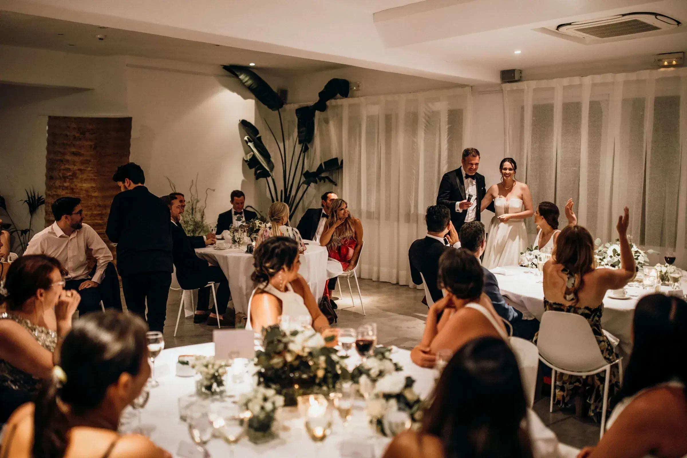 Hacienda Na Xamena: Wedding dinner in the salon with guests applauding the couple